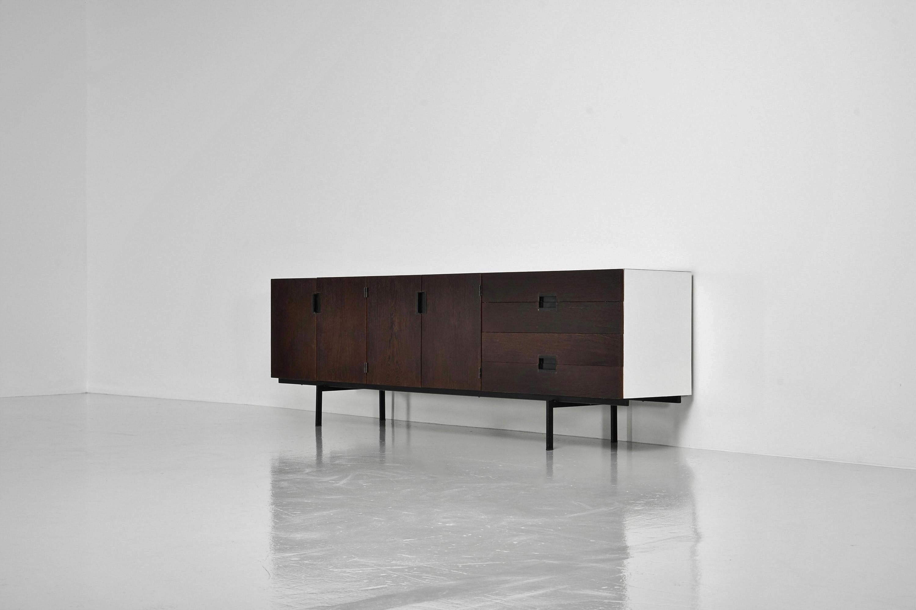 This is for an iconic and nice minimalist sideboard model number DU03, designed by Cees Braakman and manufactured by Pastoe UMS, Holland 1958. This unique sideboard was made on request for the previous owner and has compared to the regular teak