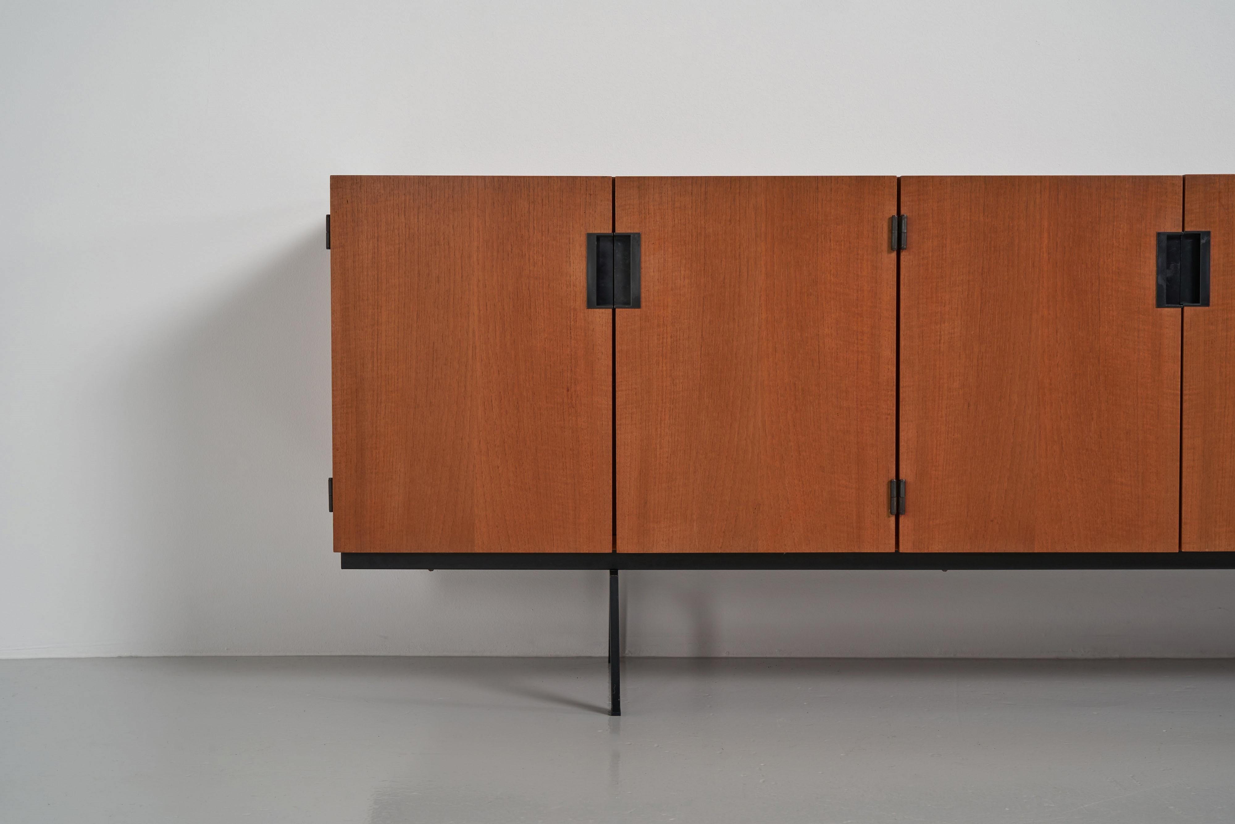 This is for an iconic and nice minimalist sideboard model number DU03, designed by Cees Braakman and manufactured by Pastoe UMS, Holland 1958. This minimalistic designed sideboard has beautiful, sophisticated detailed features. The handles are made