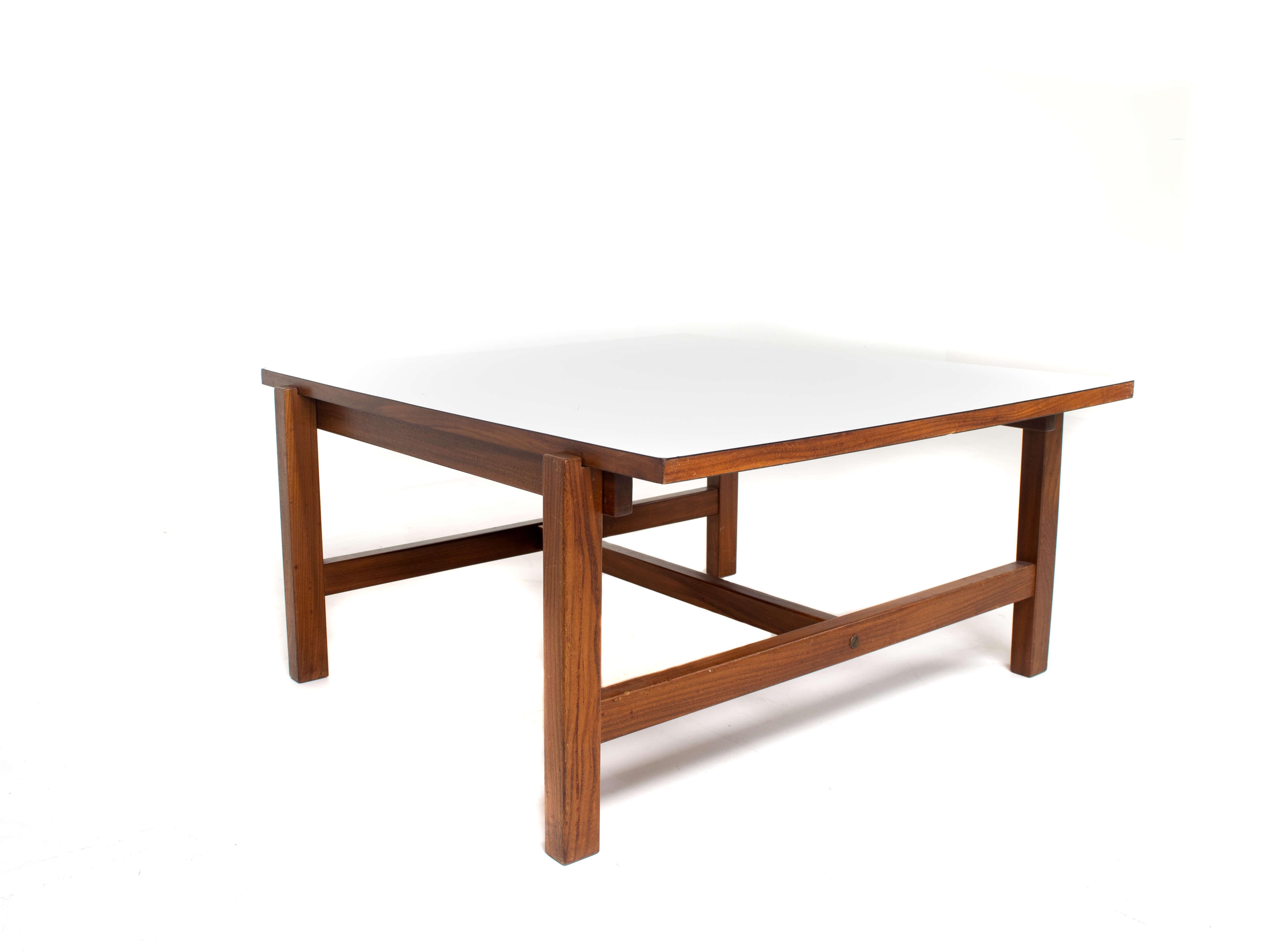 Pastoe coffee table Model TA 07 by Cees Braakman with reversible top, Netherlands 1950s. This Coffee Table is made of Teak Wood and has a reversible top with teak veneer on one side and a white formica layer on the other side. It really gives this
