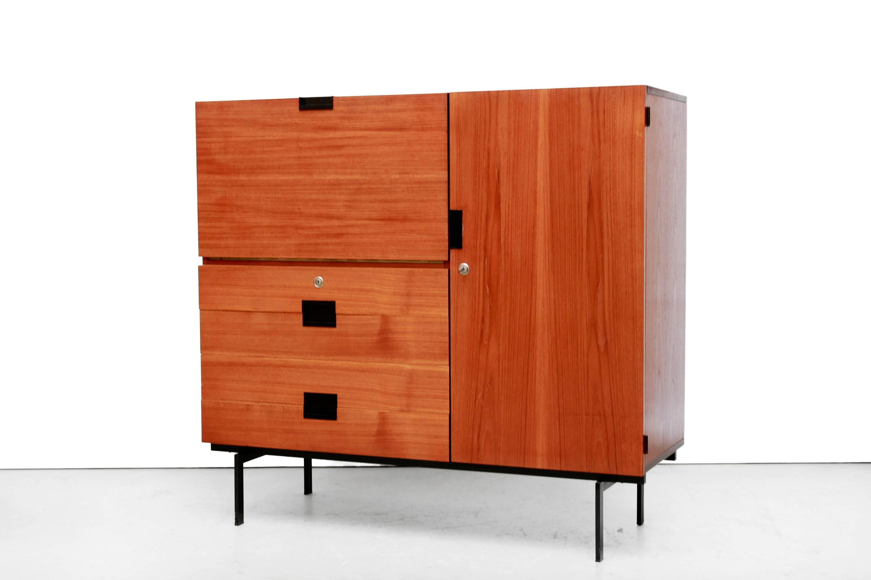 Dutch minimalist cabinet from the so called 'Japanese Series' by designer Cees Braakman for Dutch manufacturer UMS Pastoe from September 4, 1959. 
This cabinet is not only very beautiful but also offers plenty of storage space. 
The storage behind