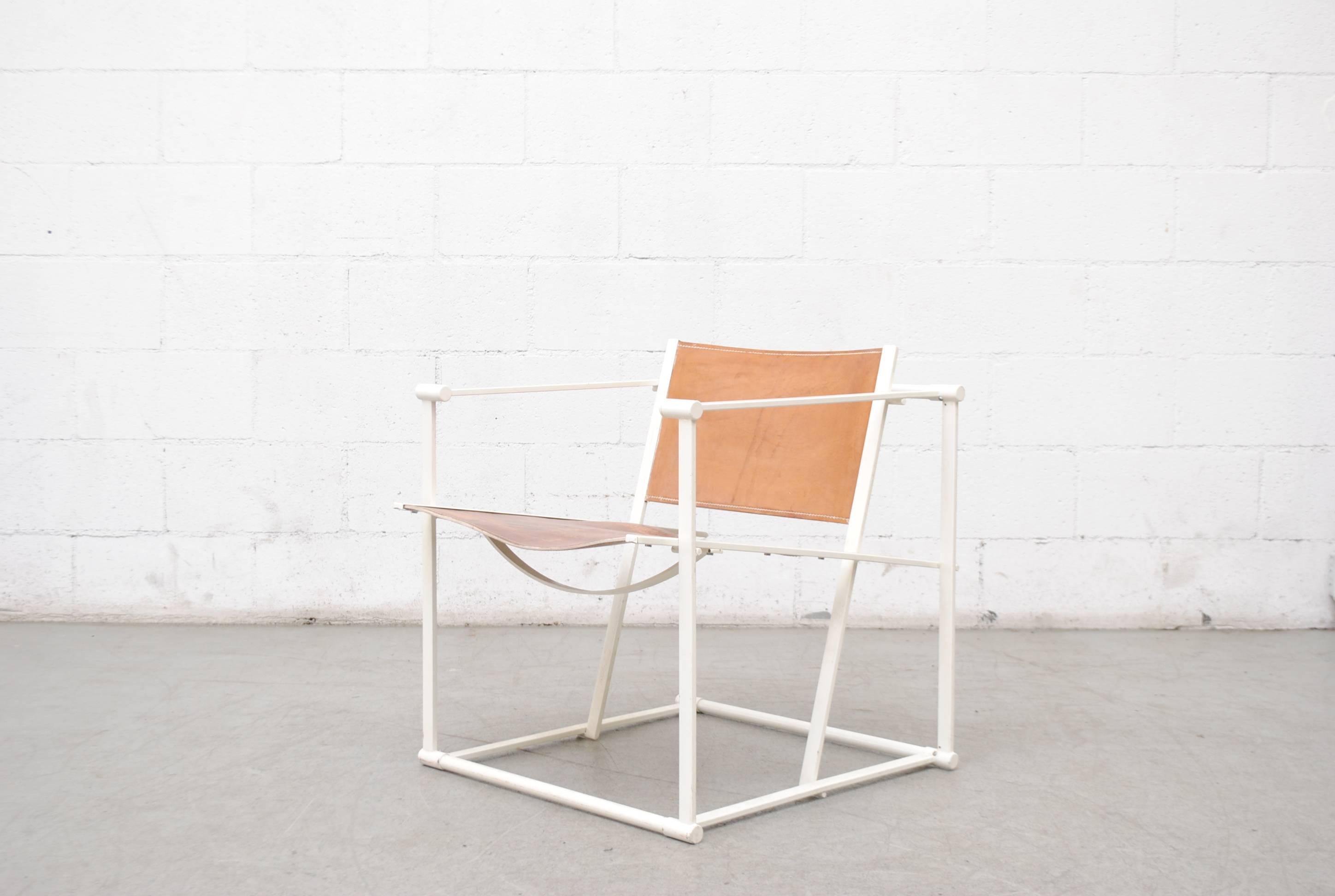 UMS Pastoe FM60, Cubic chair lounge chair, designed in 1980 by Radboud Van Beekum. White Enameled steel frame with natural leather seating. Frame is in original condition with some wear to enamel. Beautiful patina.