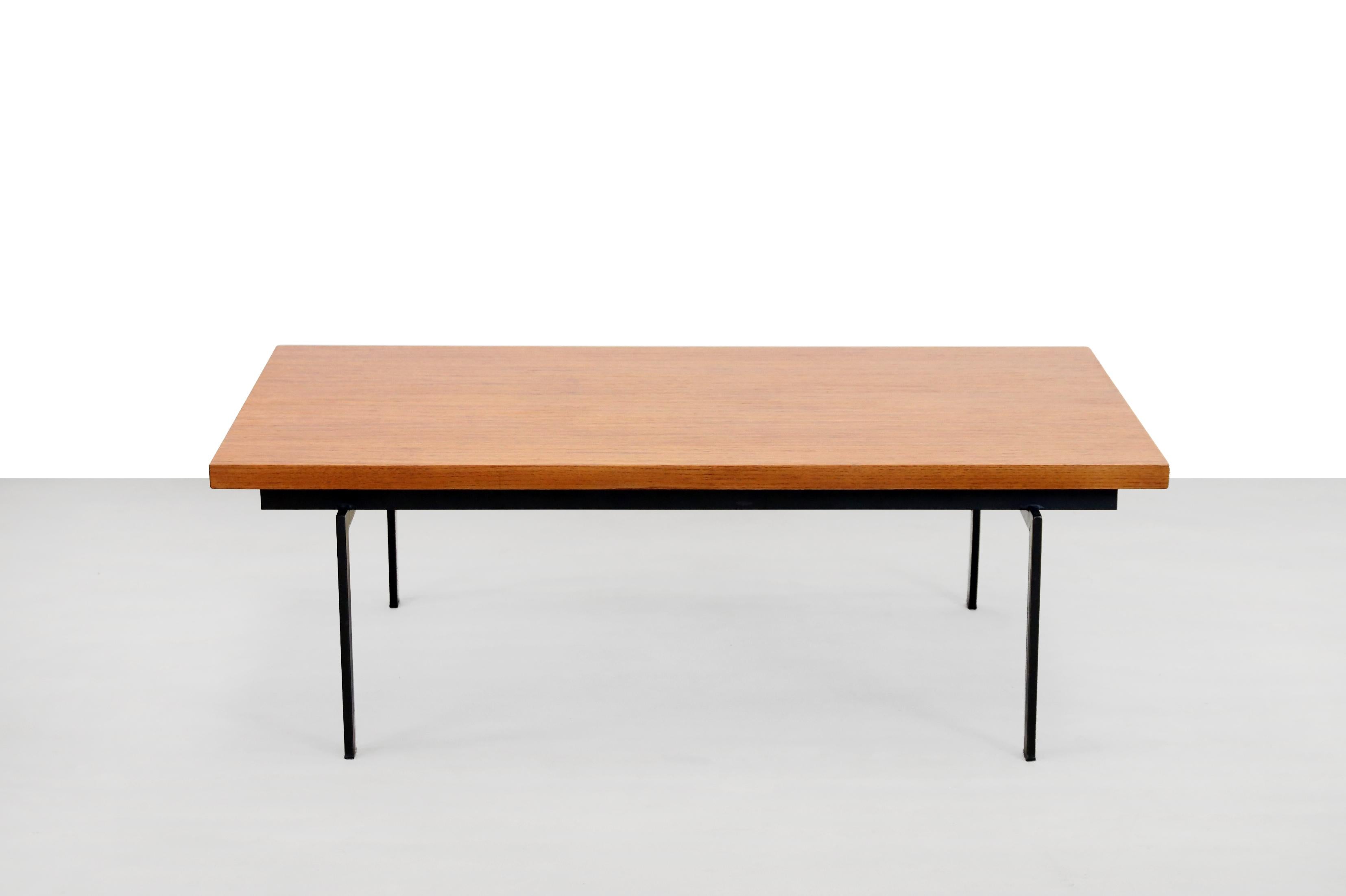 Beautiful vintage teak coffee table with metal base designed by Cees Braakman for Pastoe in the early 1960s. This table comes from the U + N series, which is also known as the Japanese series. The table top is teak veneered and is attached to the