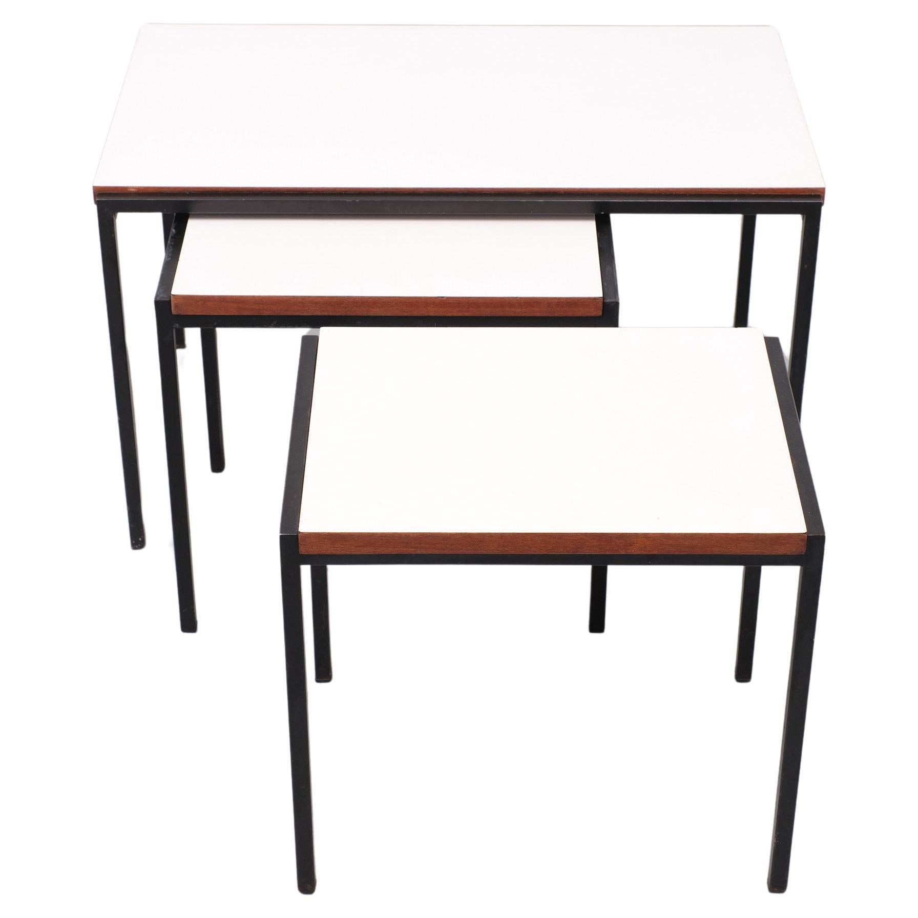 Rare set of nesting tables .Black Square Metal frame ,Comes with a White 
laminated top ,And teak wood sides . Design by Cees Braakman  for Pastoe 
from the so called ''Japan series ''  Great minimalist design . 

Please don't hesitate to reach out