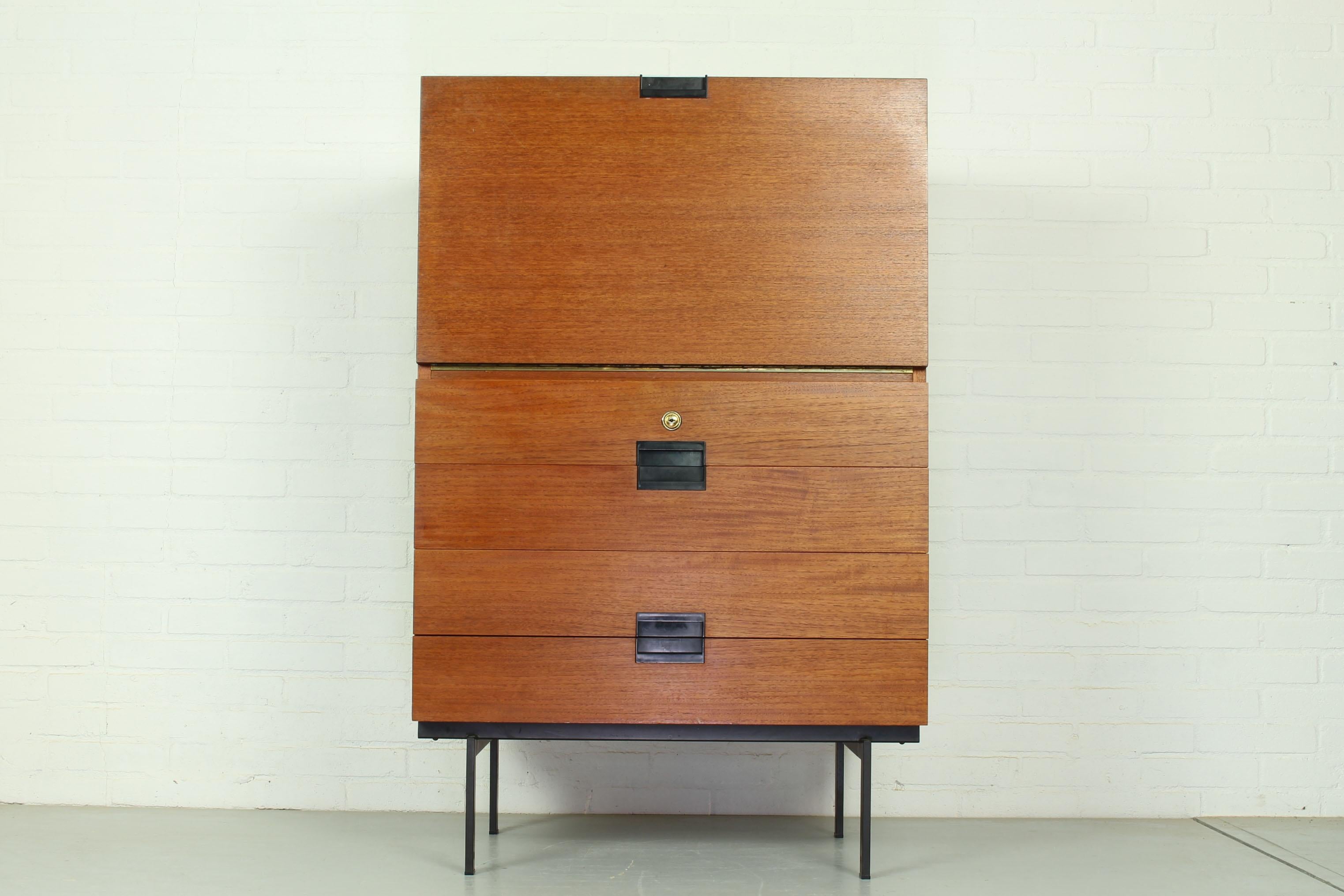 Small cabinet CU02 designed by Cees Braakman for UMS Pastoe in 1958. This elegant cabinet from the Japanese series features a teak flap, which can be used as a desk top. The condition of the cabinet is good, but the right side has some scratches and