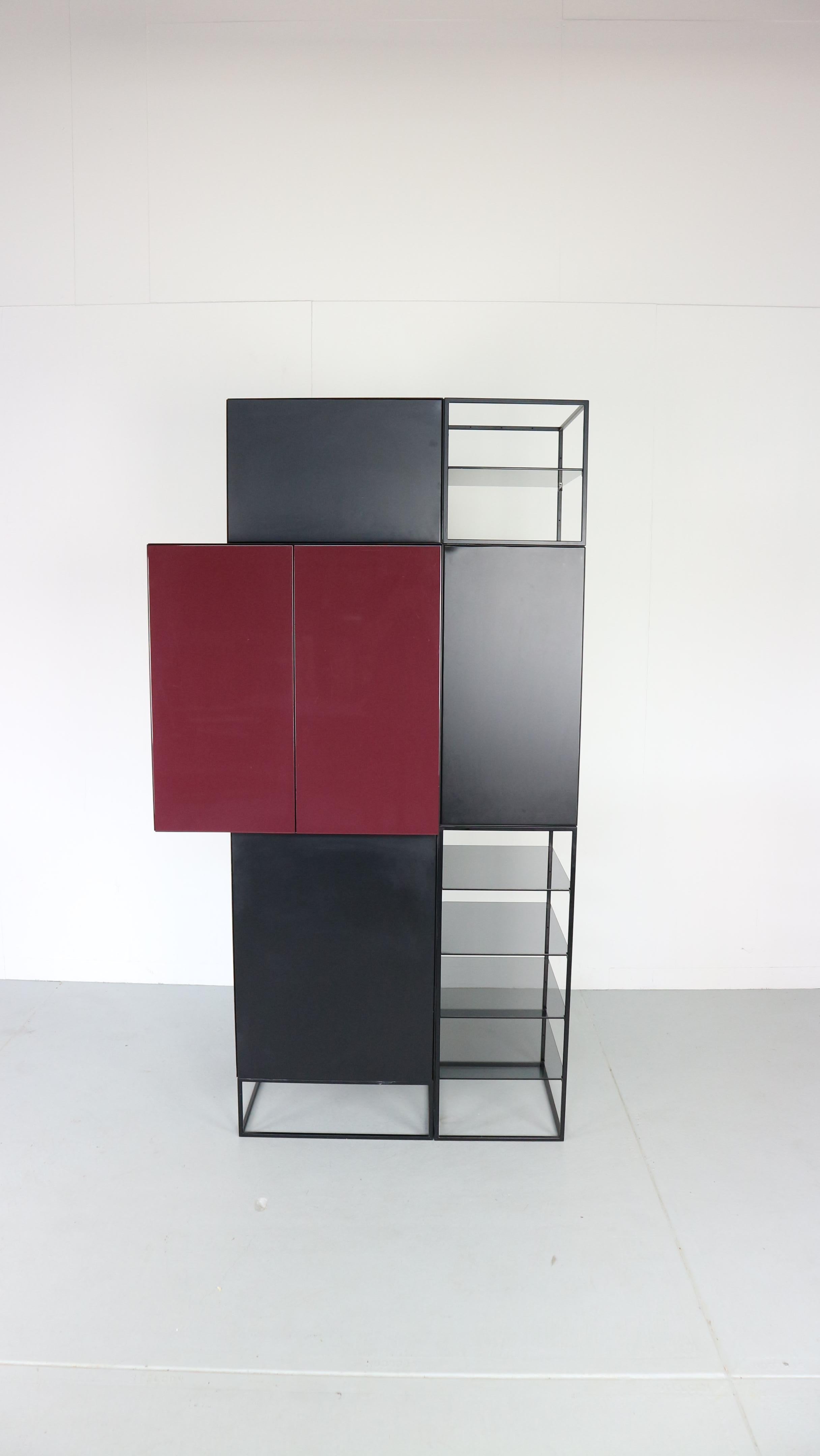 Minimalist cupboard from Mazairac and Boonzaaier for Pastoe, 1980s.
No handles, doors open by a clicking system by pushing the door.
First series by the Famous Pastoe furniture factory.
Metal black frame and wooden cabinets.