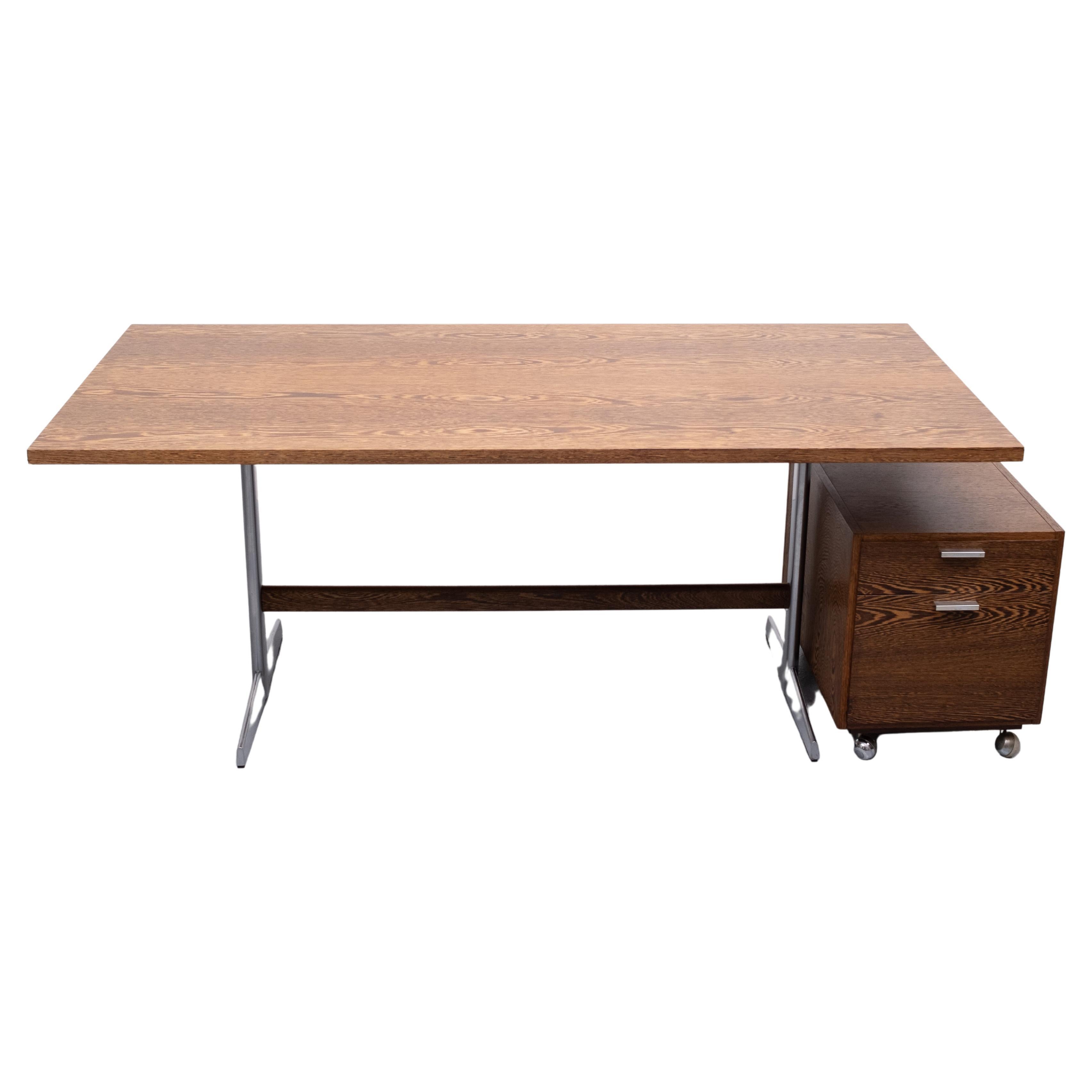 Beautiful Writing desk and matching drawer unit desk. The writing table comes with a Wengé wood 
Top standing on a polished metal feet. Very good quality set. Design by Cees Braakman for Pastoe 'GOED WONEN ' in the 1960s Holland. Good condition.