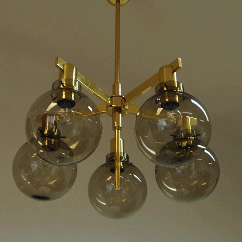 Fivearmed Pastoral Ceiling Lamp with smokey glassdomes model T348/5D produced in the 1960`s.  Designed by Hans-Agne Jakobsson for Markaryd, Sweden.
The glassdomes are  light smokey and in good condition.  The frame is in polished brass. Measures: 