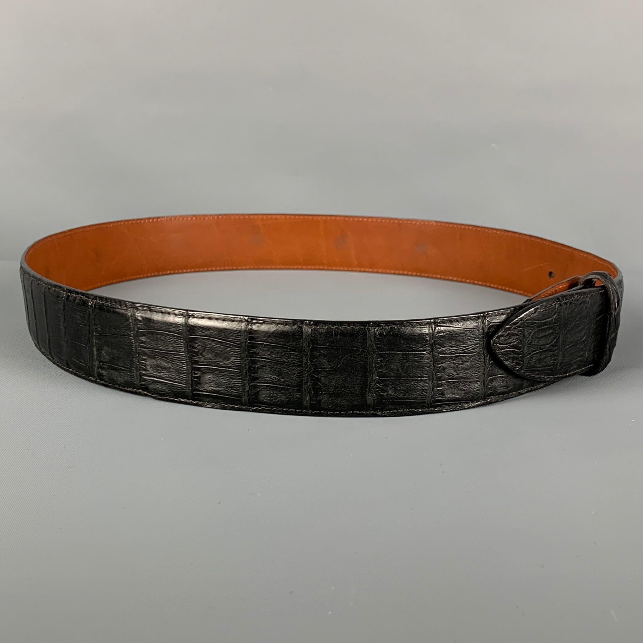 PAT AREIAS belt strap comes in a black textured alligator leather. Made in USA. 

Very Good Pre-Owned Condition.
Marked: 32

Length: 38 in.
Width: 1.5 in.
Fits: 30 in. - 34 in.
 