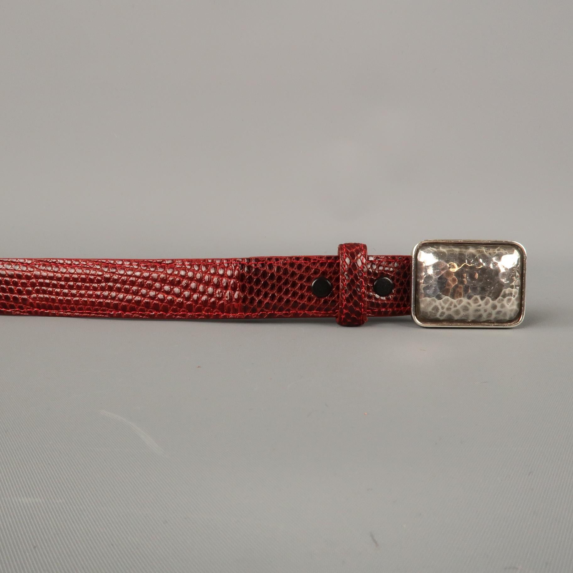 PAT AREIAS belt comes in a red lizard textured leather featuring a sterling silver buckle. Wear inside. Made in USA.  

Excellent Pre-Owned Condition.
Marked: 32

Length: 39.5 in.
Width: 1.5 in.
Fits: 31.5 - 34.5 in.