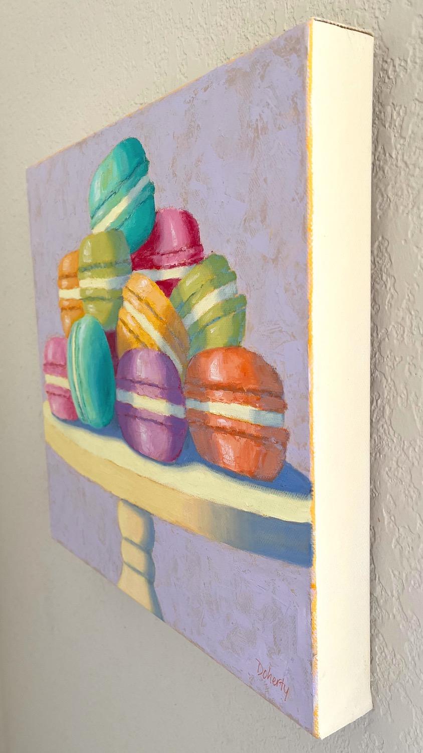<p>Artist Comments<br />A luscious assortment of colorful French macarons rests on a white pedestal plate. Artist Pat Doherty balances the elements in the composition, establishing harmonious color relationships between light and shadow. The purple