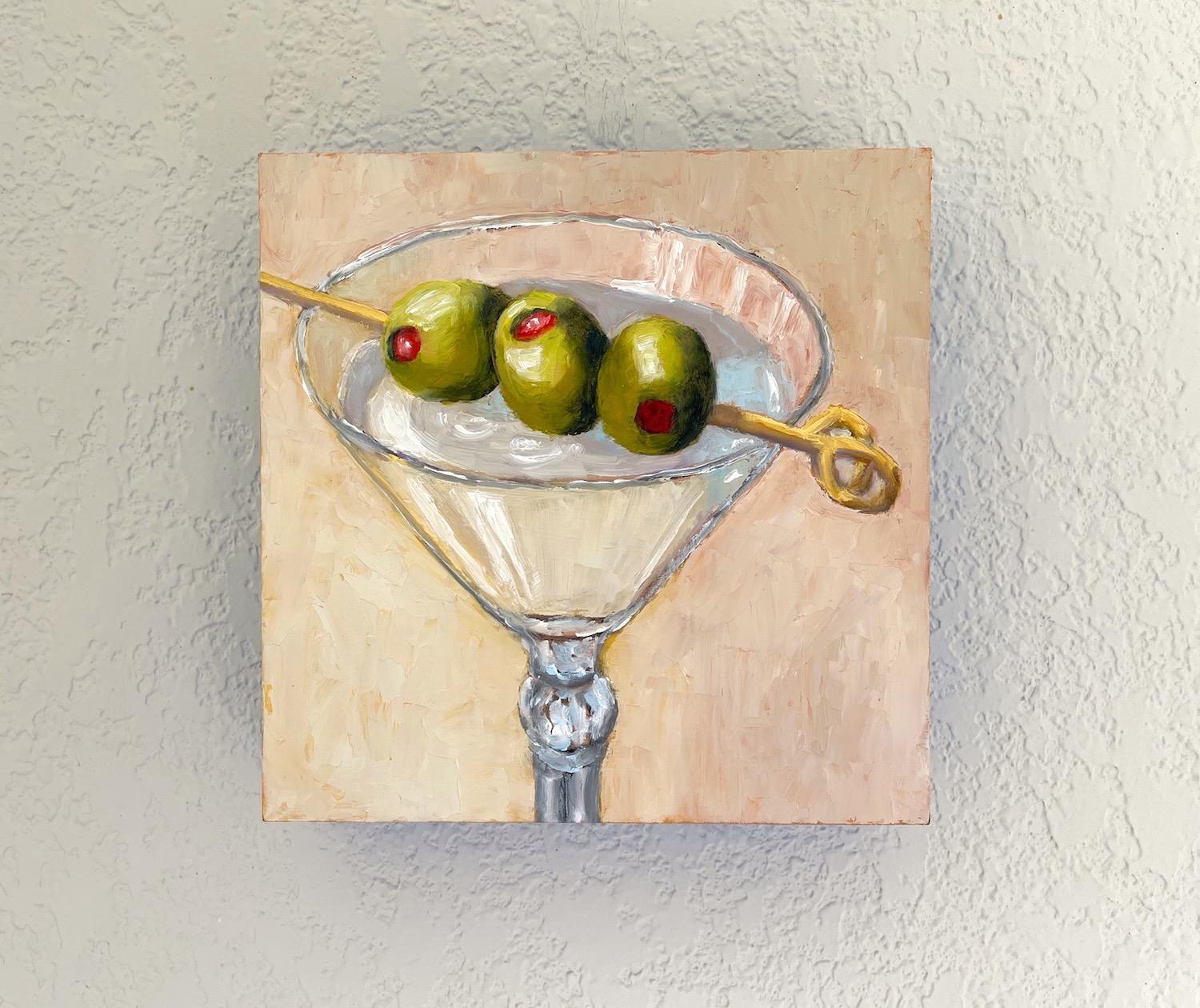 <p>Artist Comments<br>A sophisticated martini stands against a neutral background. Vivid green olives on a skewer rest on the rim of a sleek glass and add a pop of color to the concoction. The artwork emphasizes a harmonious composition while