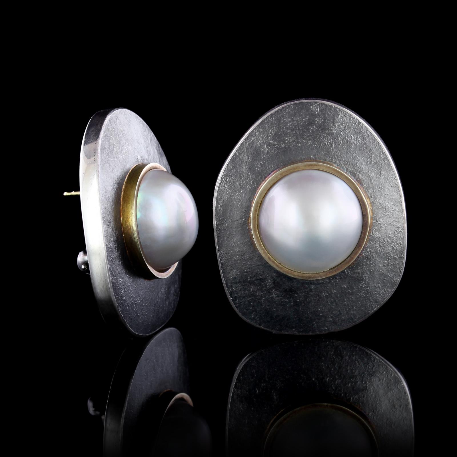 Pat Flynn Sterling Silver and 18K Yellow Gold Cultured Mabe Pearl Earrings. The
earrings are bezel set with two cultured mabe pearls each measuring 14.00mm.,
length 1 1/4