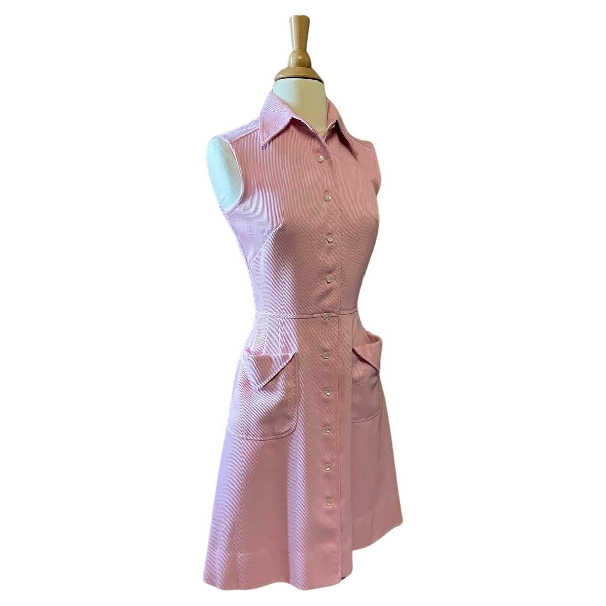 Vintage light pink dress. Fit & flare silhouette. Pointed collar. Sleeveless. Two patch pockets. Button closure. Dress falls to knee length.  Dry cleaned.

Circa 1960s
Pat Premo of California
50% Cotton 50% Poly - Ribbed Twill
Pink
Excellent