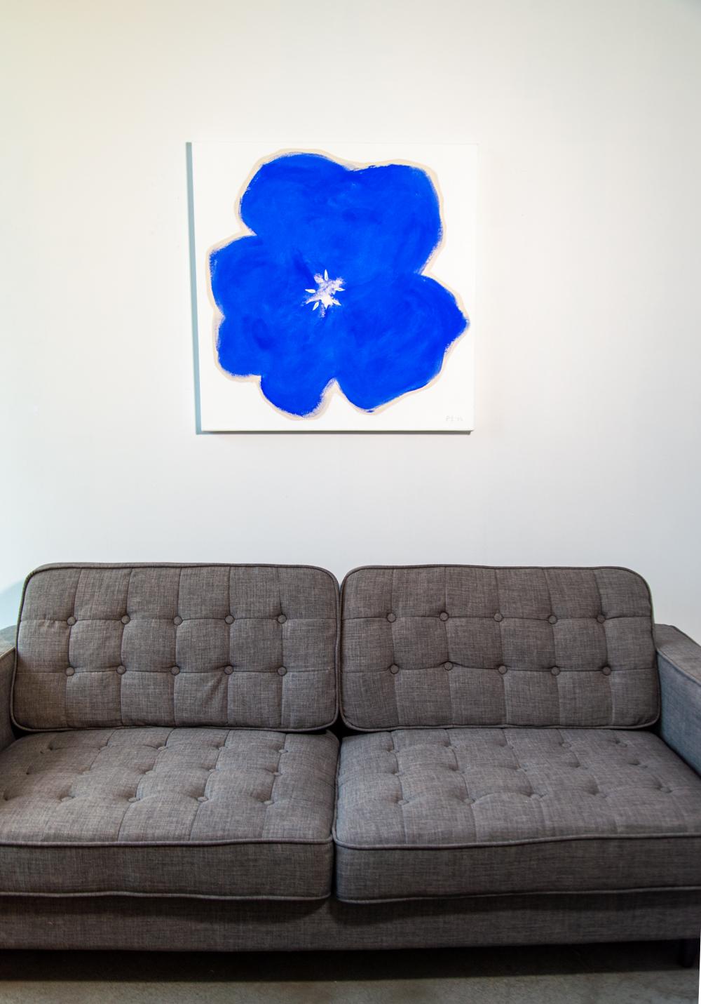 The distinctive shape of a pansy in bright blue pops from the canvas in this engaging floral abstract by Vancouver artist, Pat Service. Reminiscent of Andy Warhol, Service’s flowers are pared down to the essentials--simple shapes without leaves or