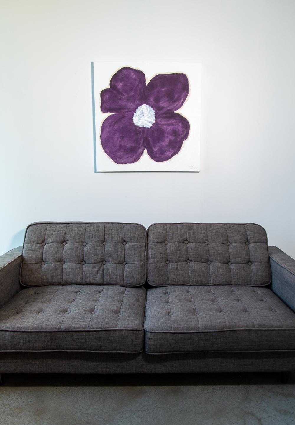 A rich dark purple pansy fills the canvas in this engaging abstract floral by Vancouver artist, Pat Service. The bright white pistil/center provides contrast. Reminiscent of Andy Warhol, Service’s flowers are pared down to the essentials--simple