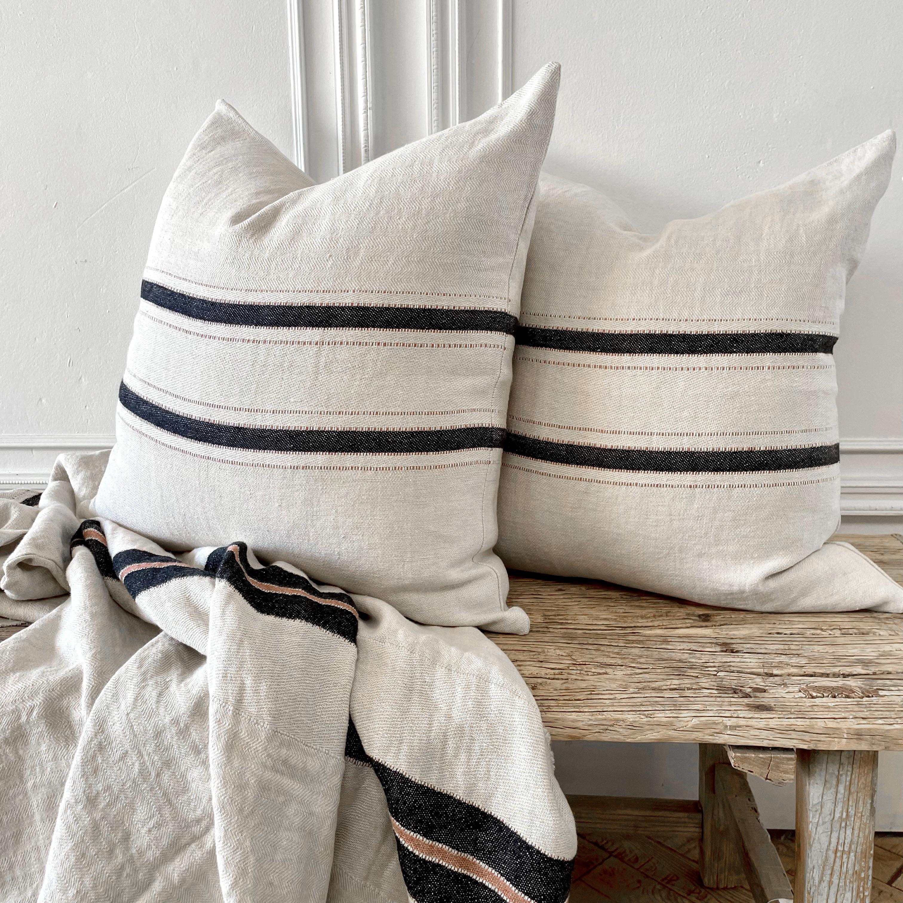 This pillow cover is inspired by The Belgian Towel. The design is simple, with black and old rose stripes sitting on an ecru ground. Includes down insert. Our pillows are constructed with vintage one of a kind textiles from around the globe.