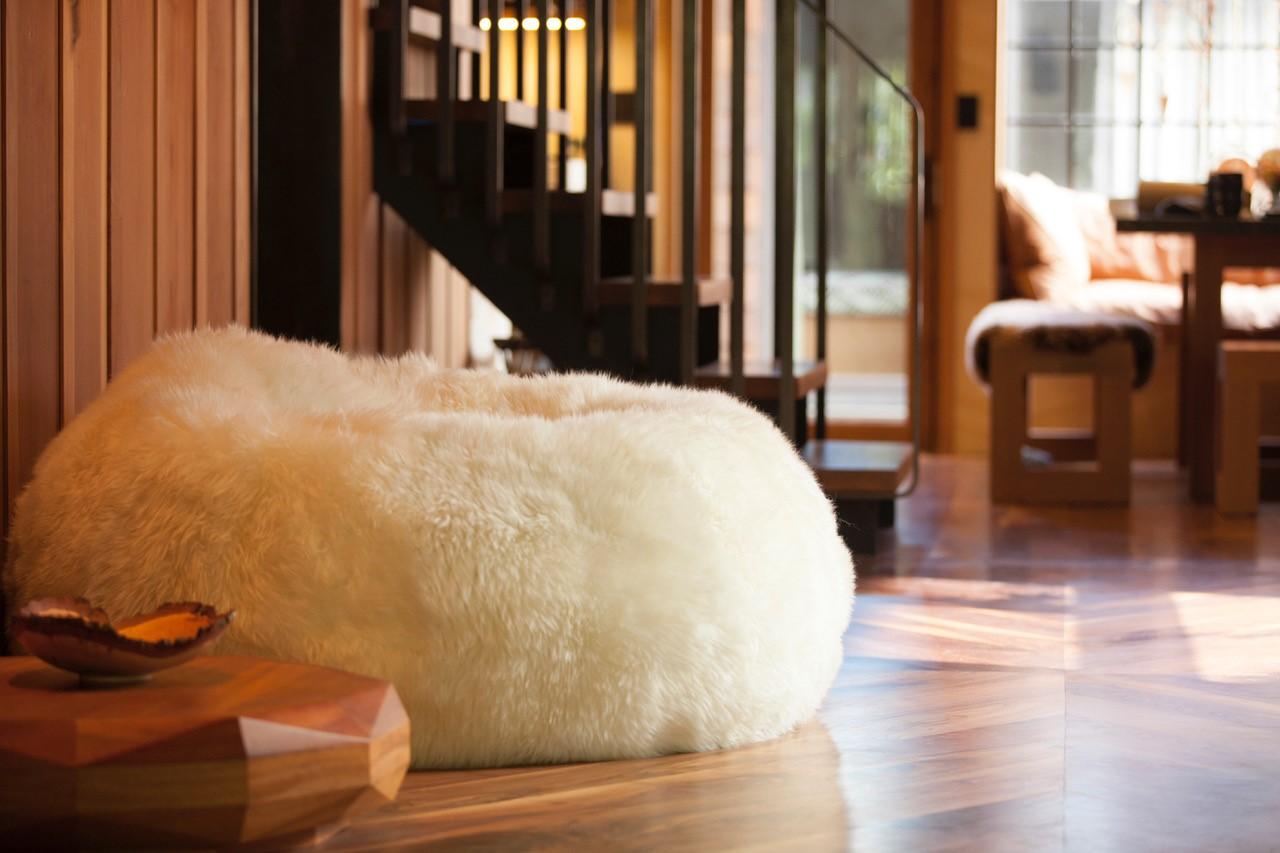 Want something to love? Grand splendid has taken the classic beanbag and “poufed” it. The pouf is made of the finest and most luxurious Patagonian sheepskin. So soft that it feels as if you've disappeared in a cloud. This sheepskin lounge chair is a