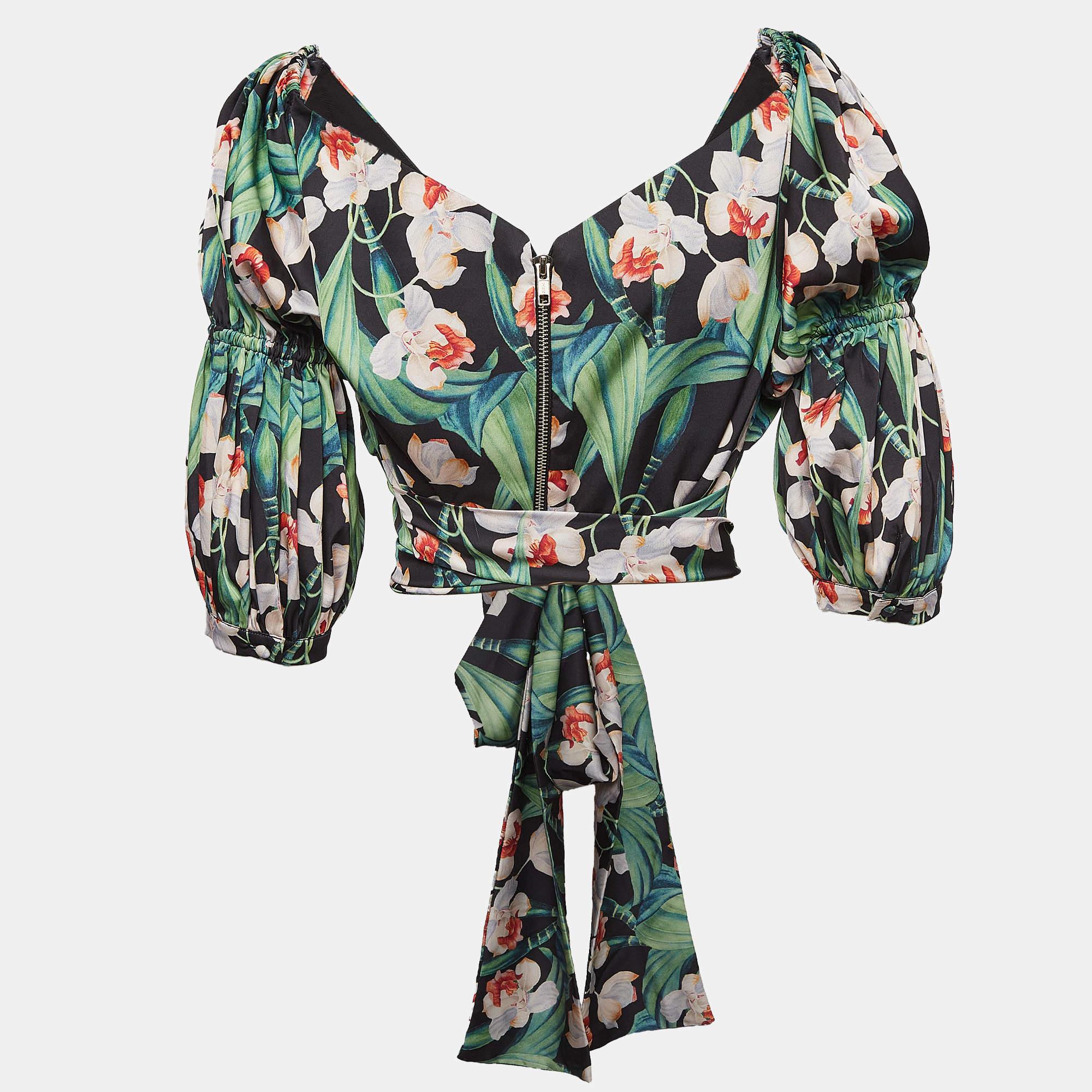 Super easy to style  be it with tailored trousers  jeans  or skirts  this PATBO top is a fine piece your closet will welcome. It has floral prints  a front buckle like detail  and a tie.