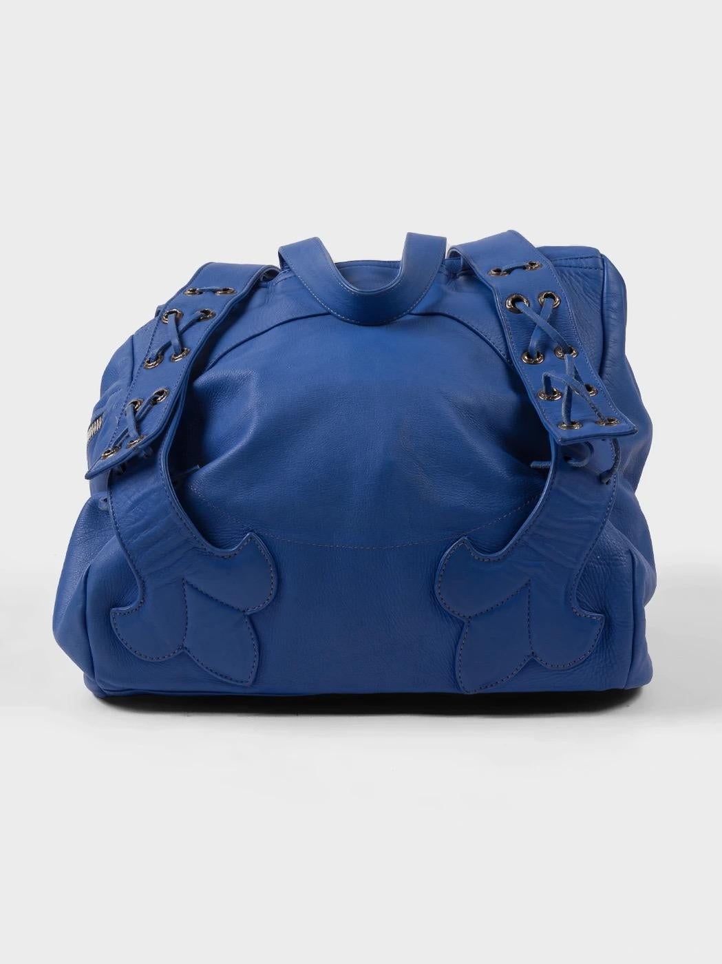 Here is an incredible leather bag/backpack from Chrome Hearts in a stunning blue colorway. This bag also features large leather patches throughout the piece.