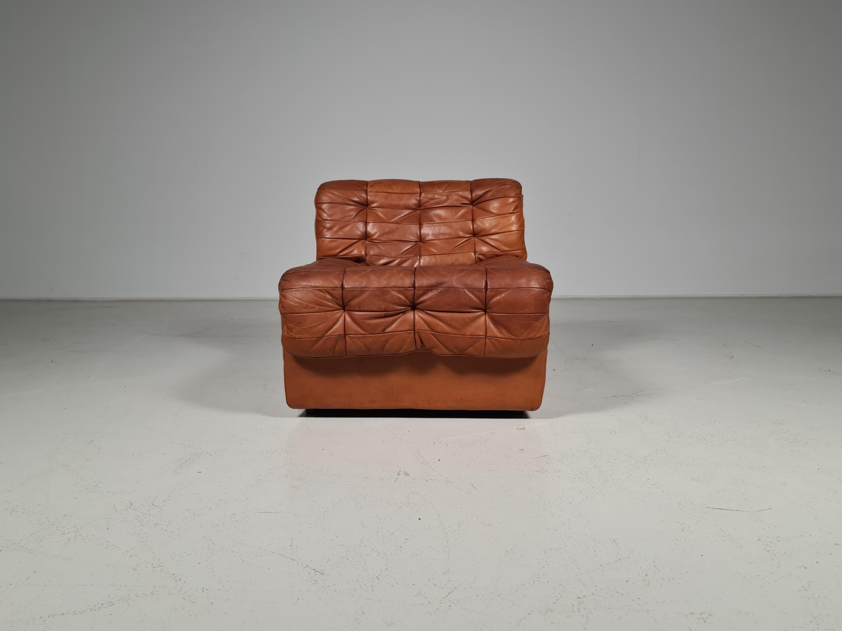 Cognac leather patchwork De Sede DS11 chair, Switzerland, 1970s. Amazing patina.
 