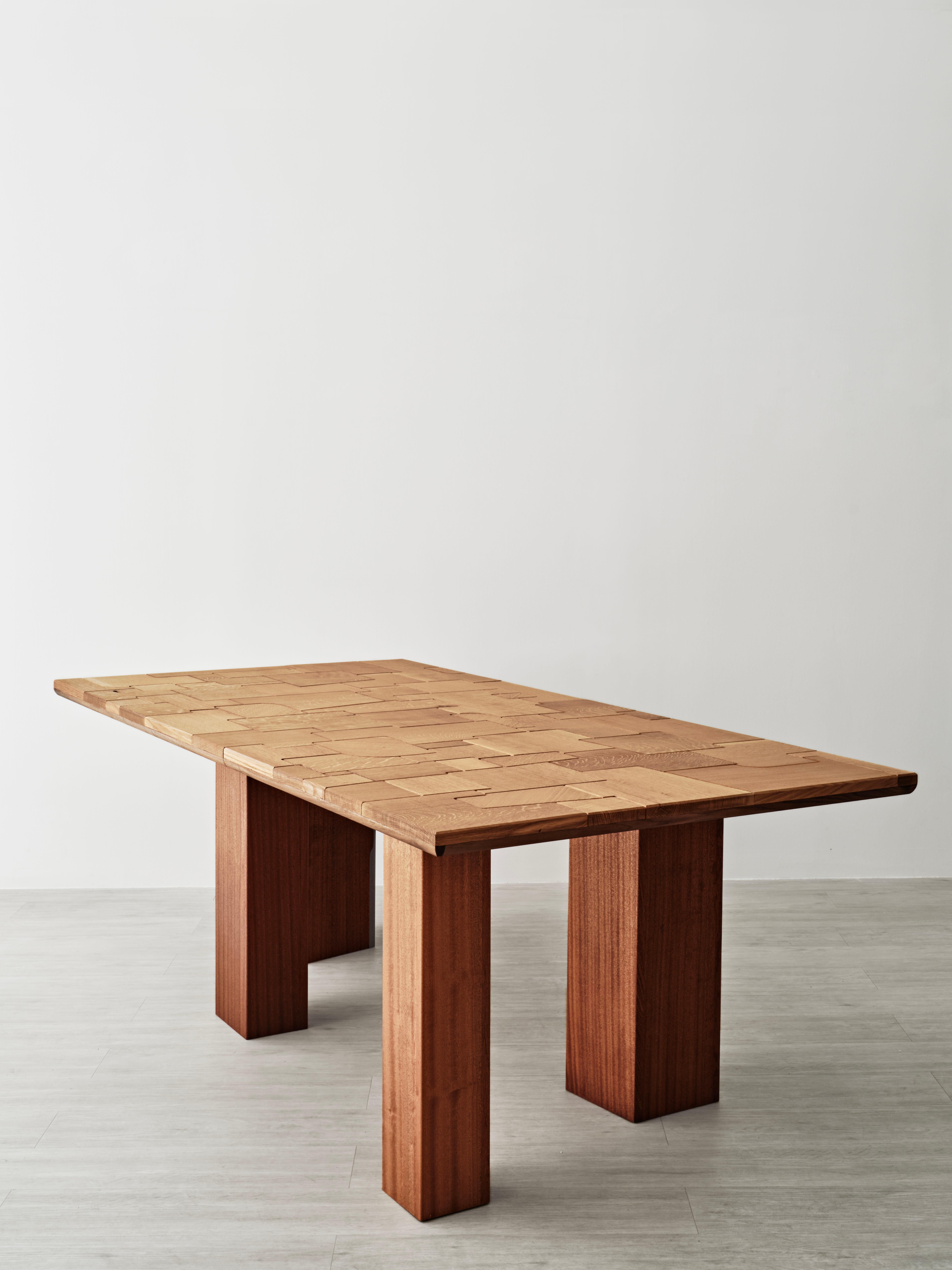 Each patchwork table is a unique piece, composed of hand-selected timbers which are laid out to create a composition that honors the characteristics of the wood while responding to proportion and the function of the piece. Shown here in white oak,