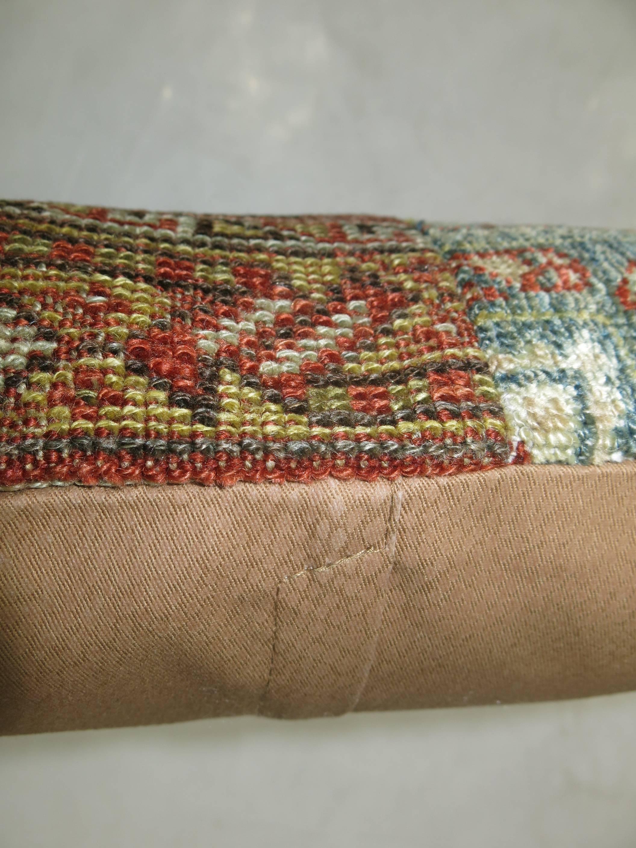 Pillow made from an assortment of vintage Persian rugs with cotton back. Zipper closure and foam insert provided. Measures: 17” x 17”.