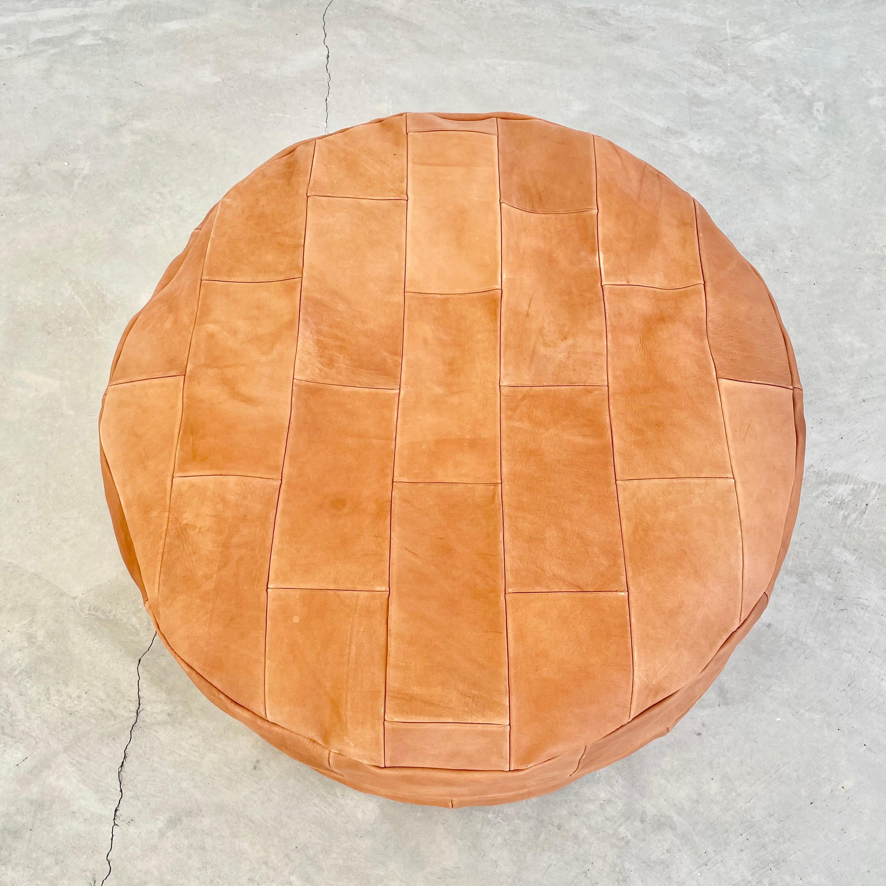 Gorgeous new production brown leather pouf from Morocco. Square patchwork design in a thick saddle cowhide. Larger size making it perfect as a foot rest and comfortable seat as well. Handmade with extreme attention to detail, these leather poufs