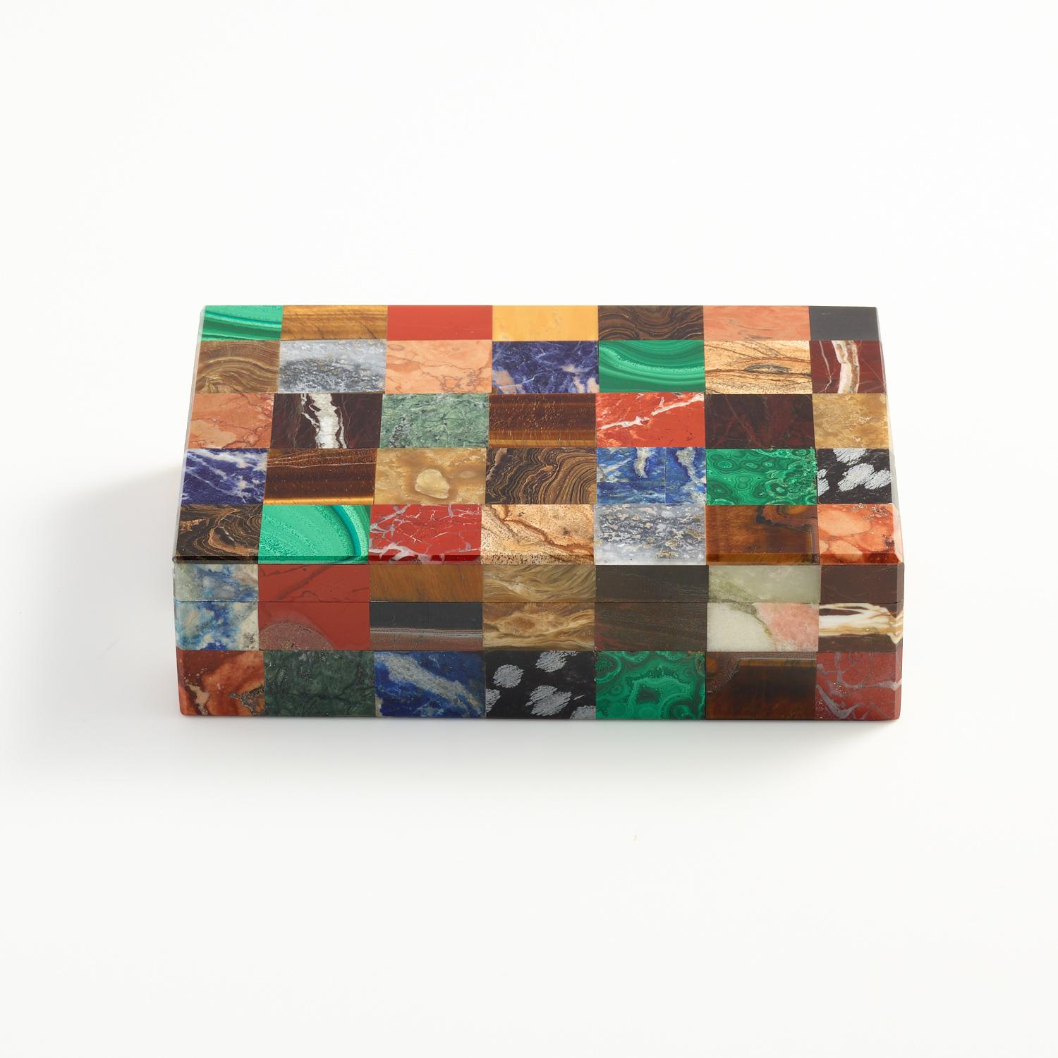 A colorful patchwork stone specimen box, Italian, circa 1930.

Excellent quality both on the exterior and interior which is lined with black onyx and as can be seen the exterior stones samples are beautifully matched. 

This stunning box will
