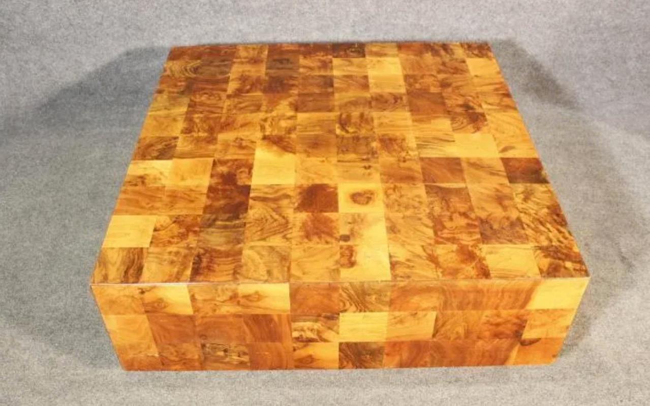 This vintage coffee table after Paul Evans features contrasting panels of burl wood in a minimal square design. Please confirm item location with seller (NY/NJ).