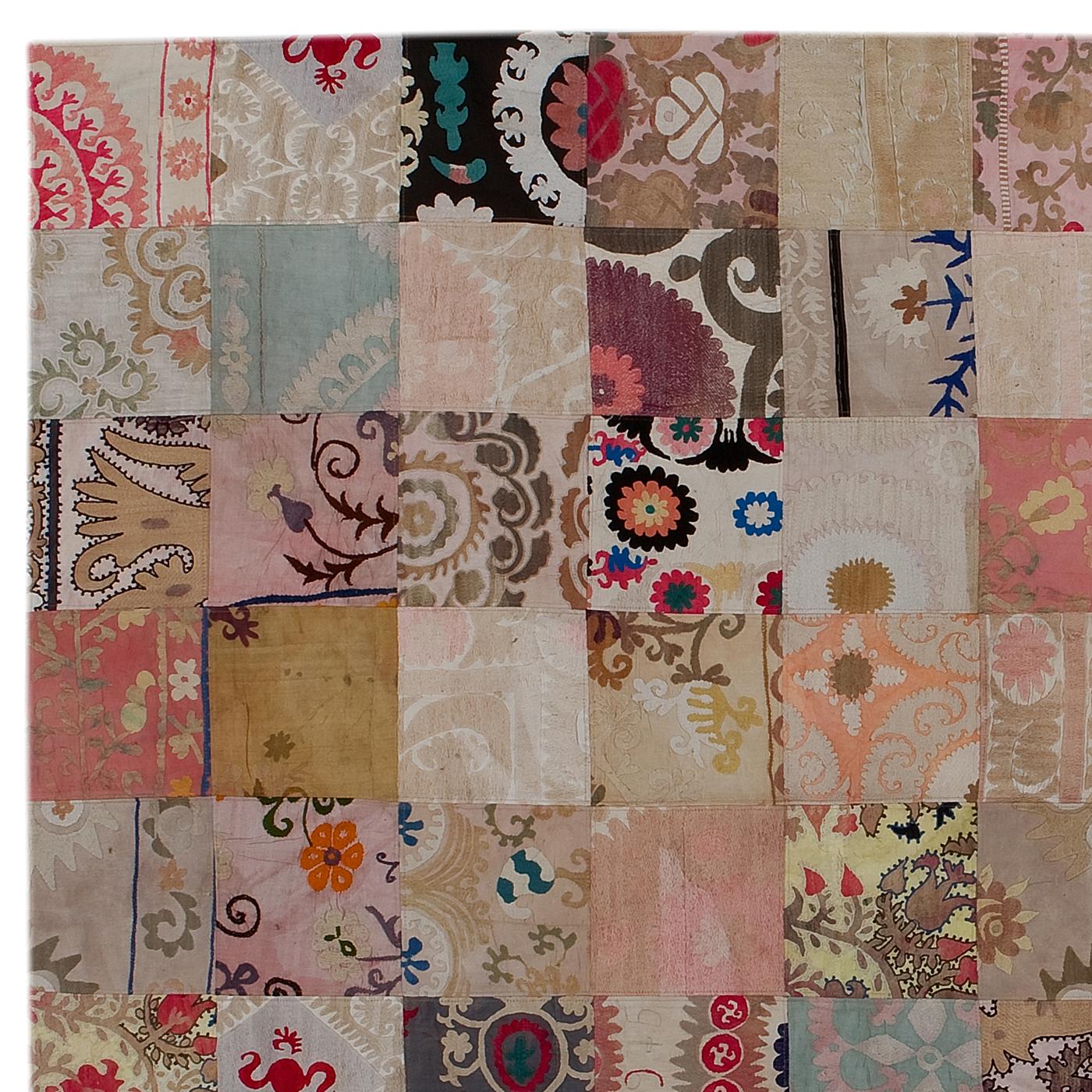 This unique carpet was entirely handmade using the patchwork technique. Its components are different pieces of vintage rugs made with varying materials and coming from different areas. The results are one-of-a-kind floor decorations that artfully