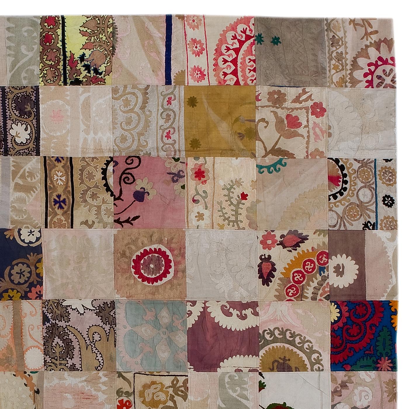Created with the patchwork technique, this carpet is a one-of-a-kind floor decoration that will make a statement in any decor. It is made entirely by hand and combines pieces of different vintage rugs made in different periods using a variety of