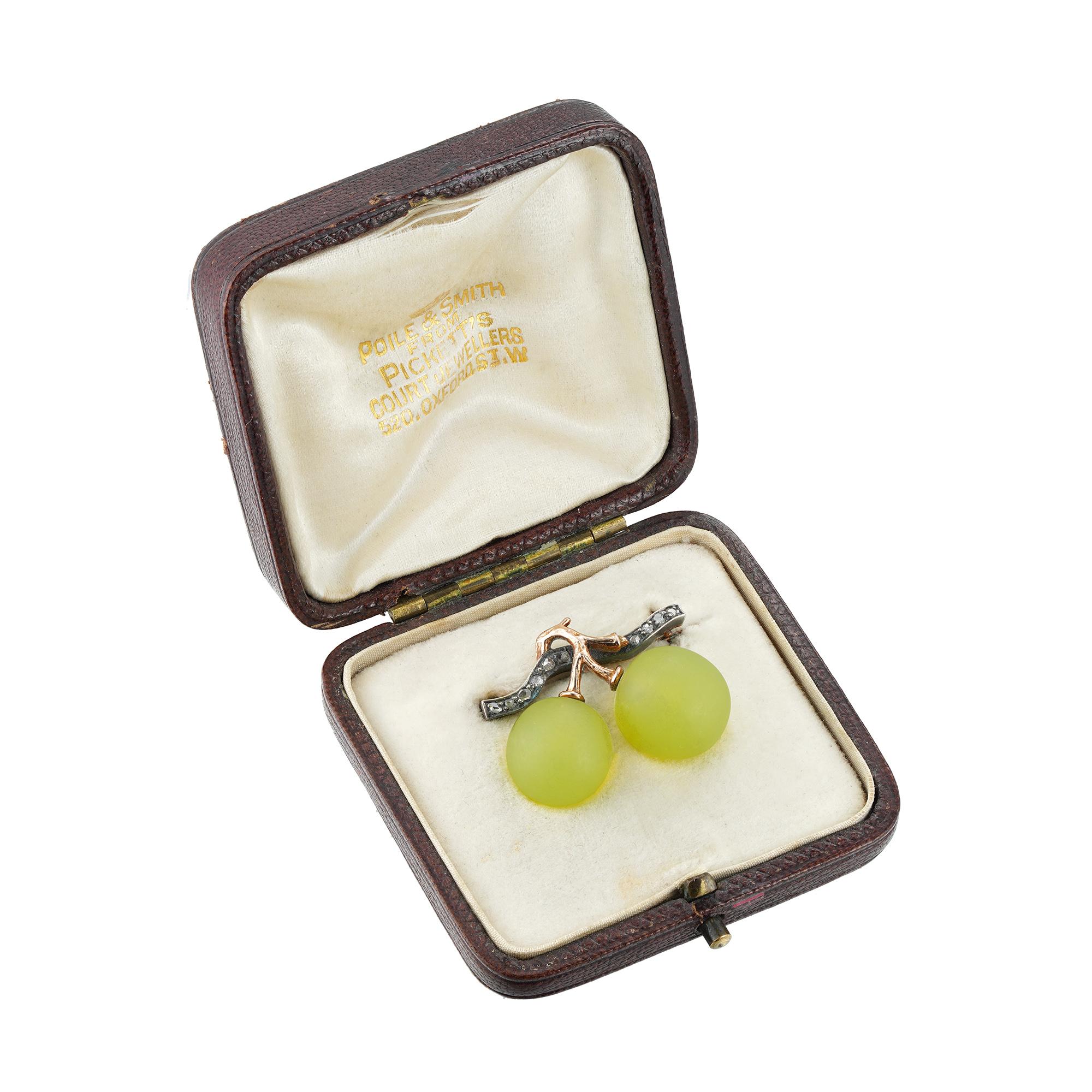 Brooch formed as a bunch of two grapes, the realistically looking grapes of pâte de verre, the stem set with rose-cut diamonds, in silver to a gold mount, French assay mark, Fonsèque et Olive, Paris,1889, measuring 2.5x2cm, gross weight 8.5