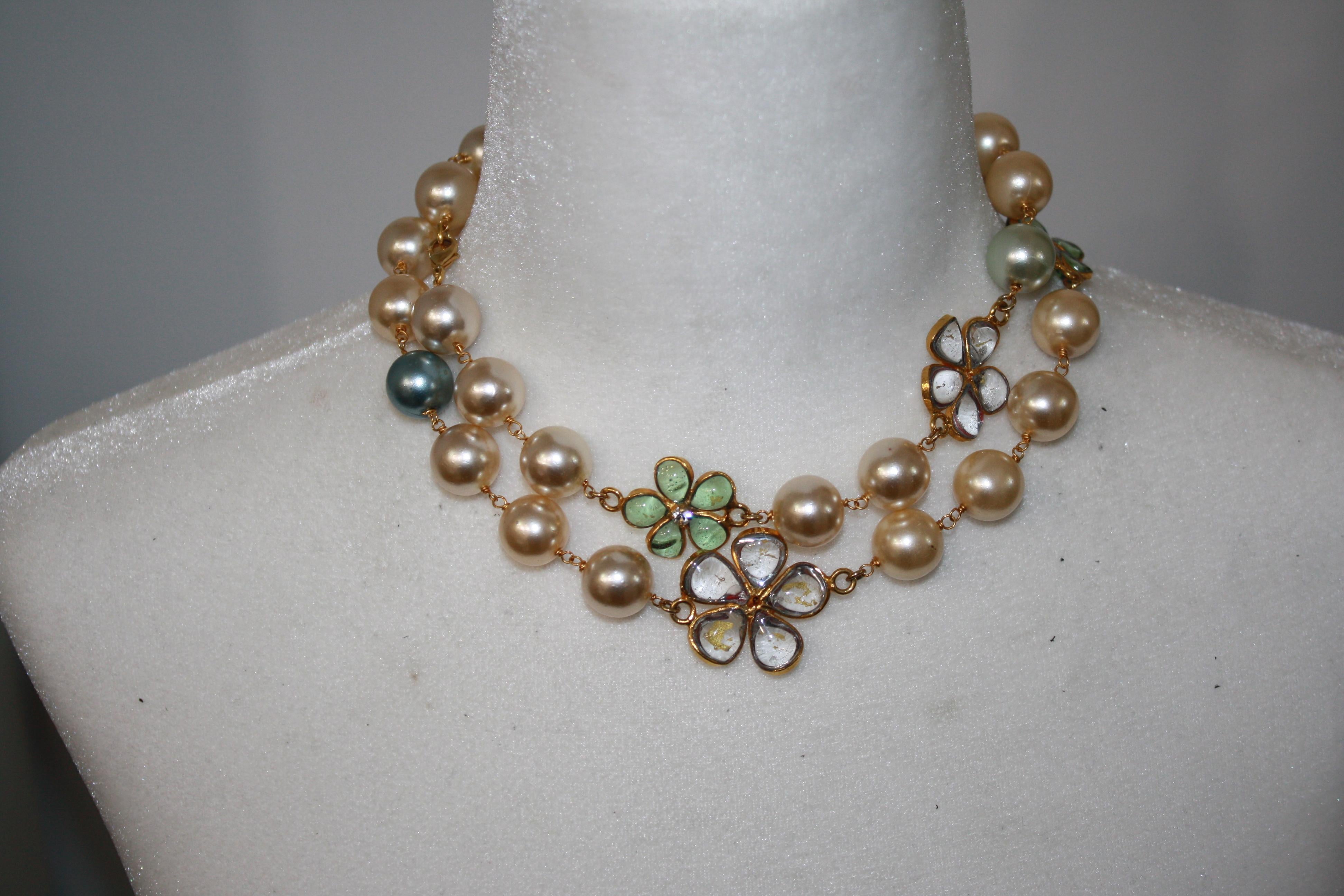 Handmade glass pearls and clover leaf motif made in different colors to pate de verre or glass paste. Gripoix work