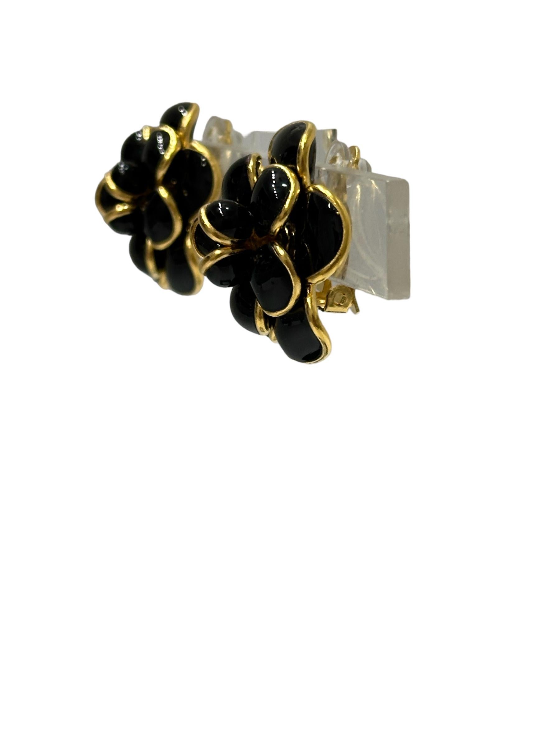designed by the former artisans of the atelier of Gripoix, made in the special process of pate de verre or poured glass.  are . 18-carat gilded brass. Clip earrings