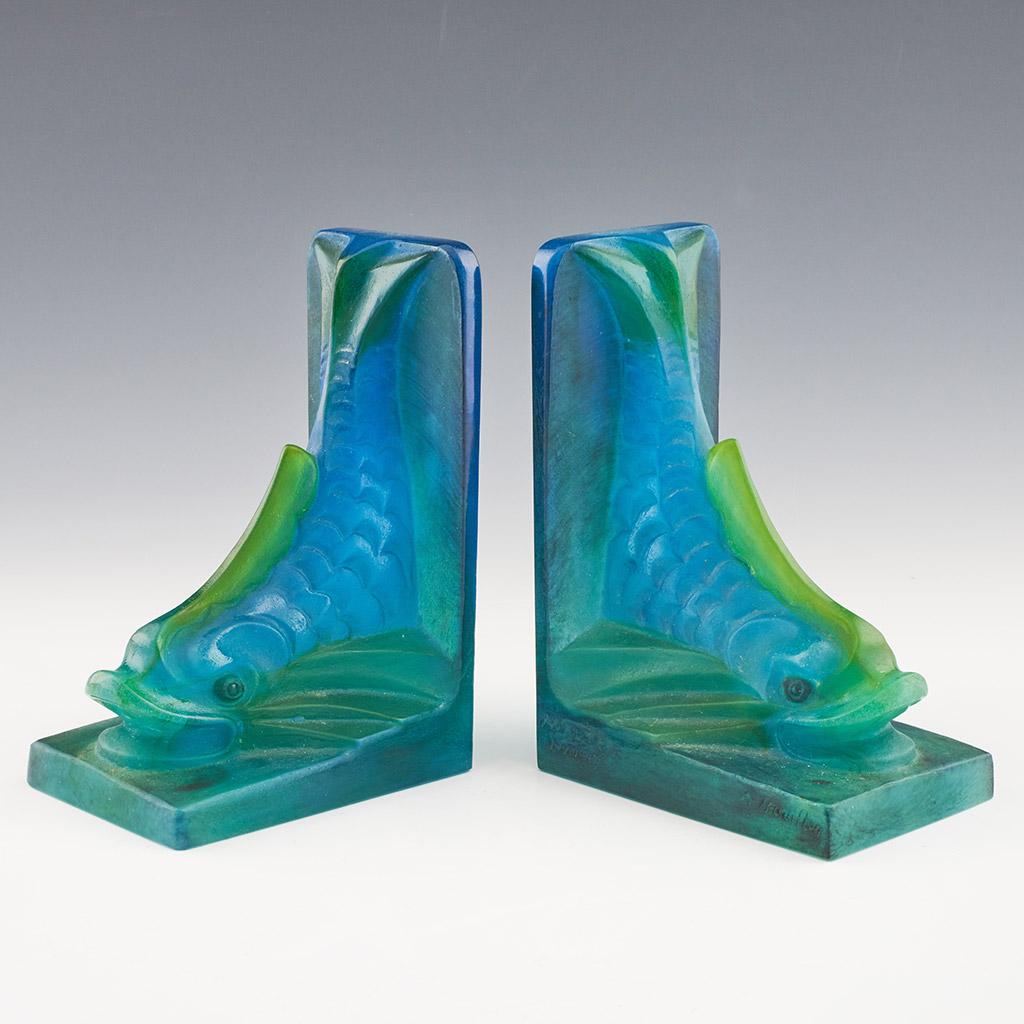 A pair of Art Deco pâte de verre bookends in the form of stylised dolphins. Designed by Auguste Houillon (1885-1954) for Amalric Walter, Nancy, France. Etched Walter Nancy and A Houillon to sides.

Origin: French

Date: circa 1930.