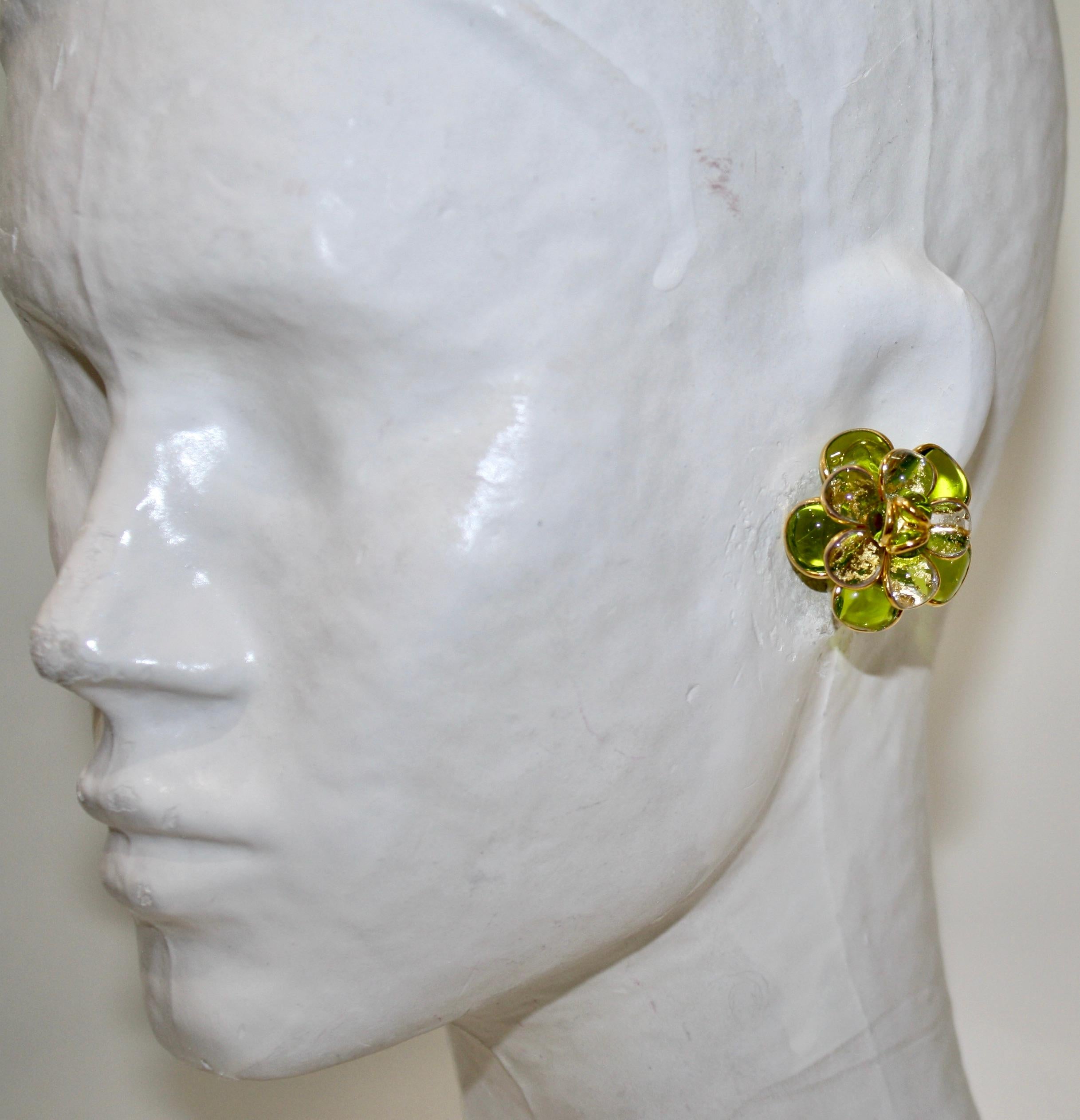 Designed by the former artisans of the atelier of Gripoix, made in the special process of pate de verre or poured glass. Gold leaves are inserted in the glass. 18-carat gilded brass. Clip earrings