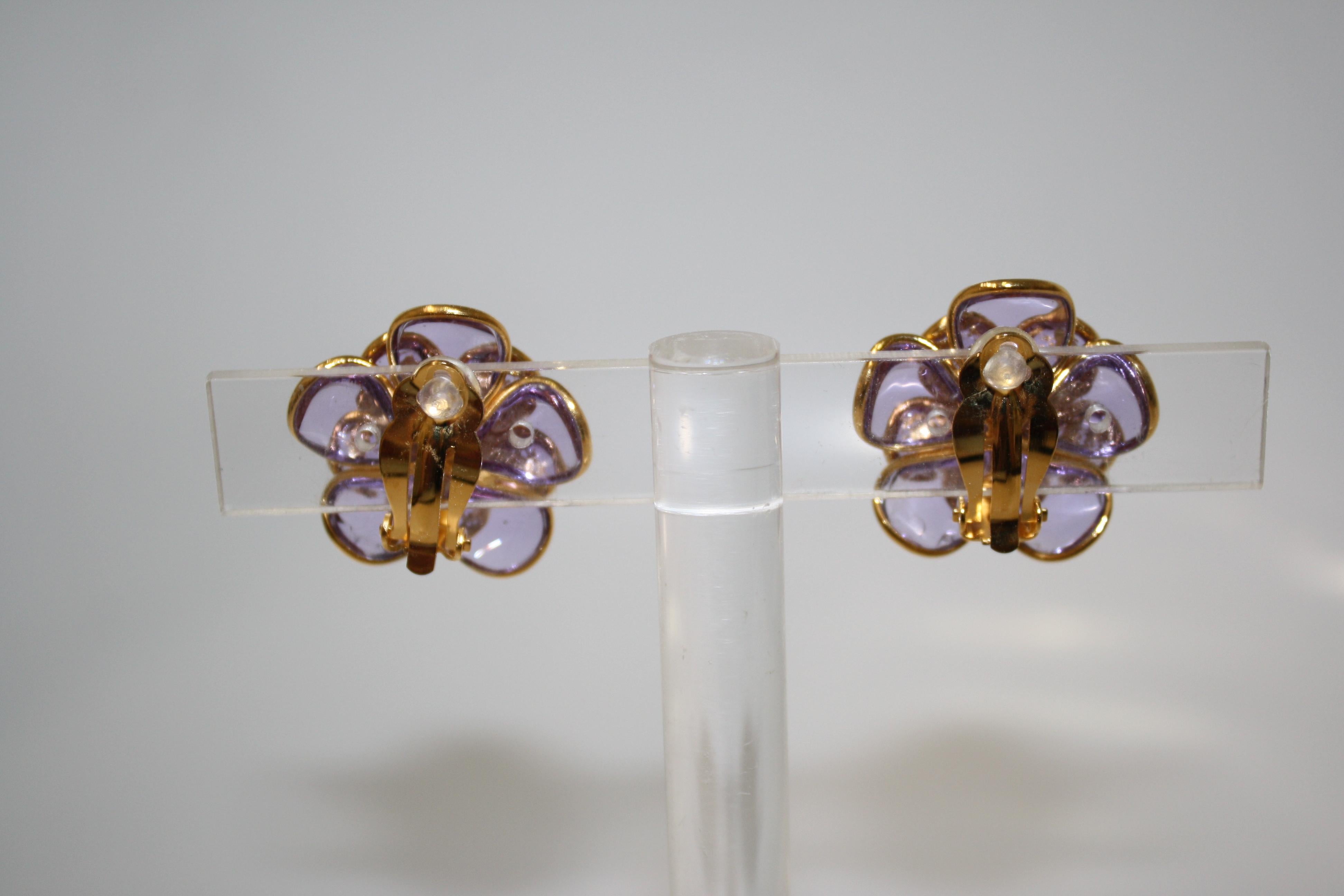 designed by the former artisans of the atelier of Gripoix, made in the special process of pate de verre or poured glass. Gold leaves are inserted in the glass. 18-carat gilded brass. Clip earrings