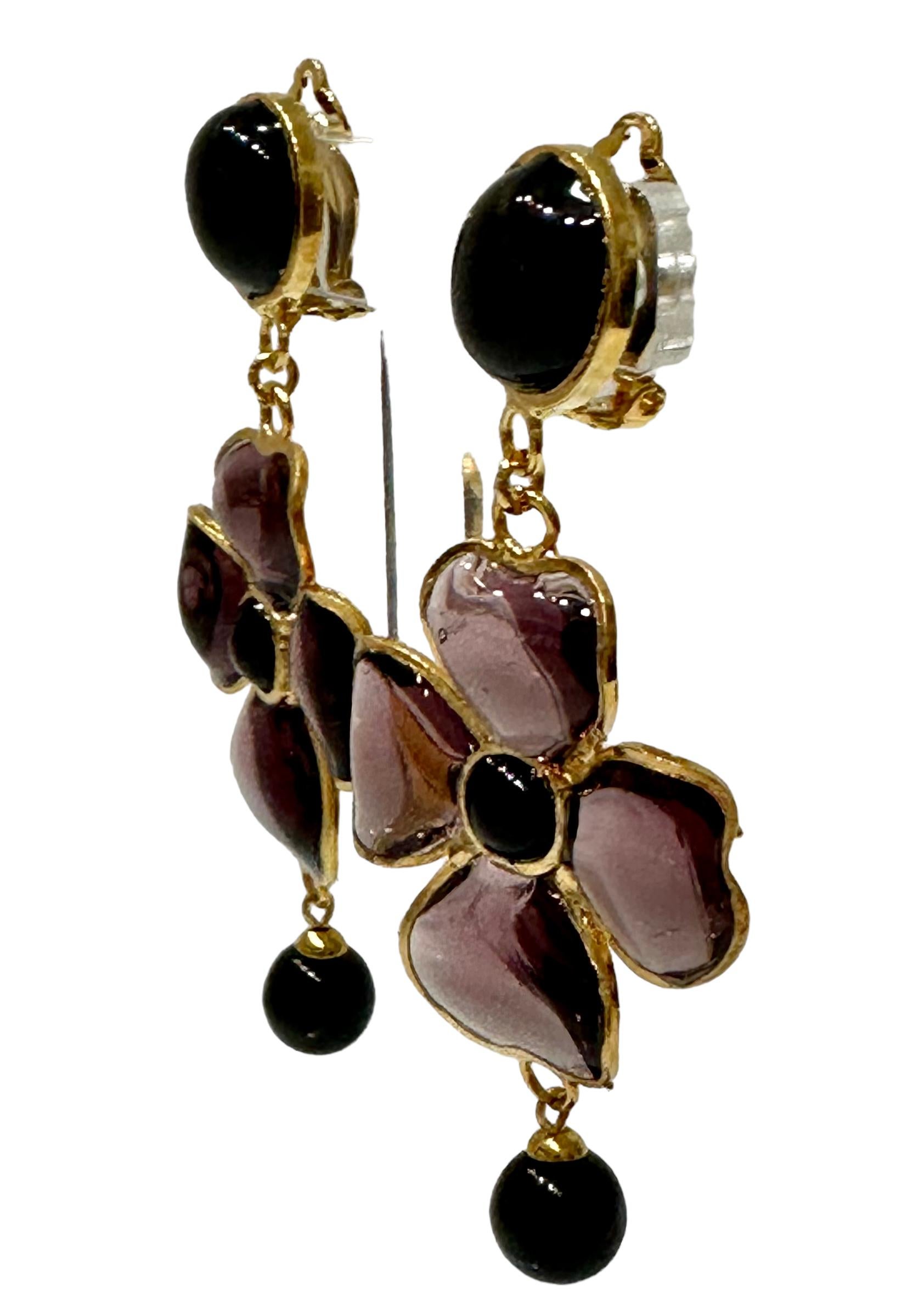 Design by Françoise Montague. Gripoix work by former artisans of the atelier. Clip earrings Gripoix work ( famed pate de verre  for the House of Chanel) was used for these clover drop earrings. Poured glass in purple  and black ,gilded brass 
Clip
