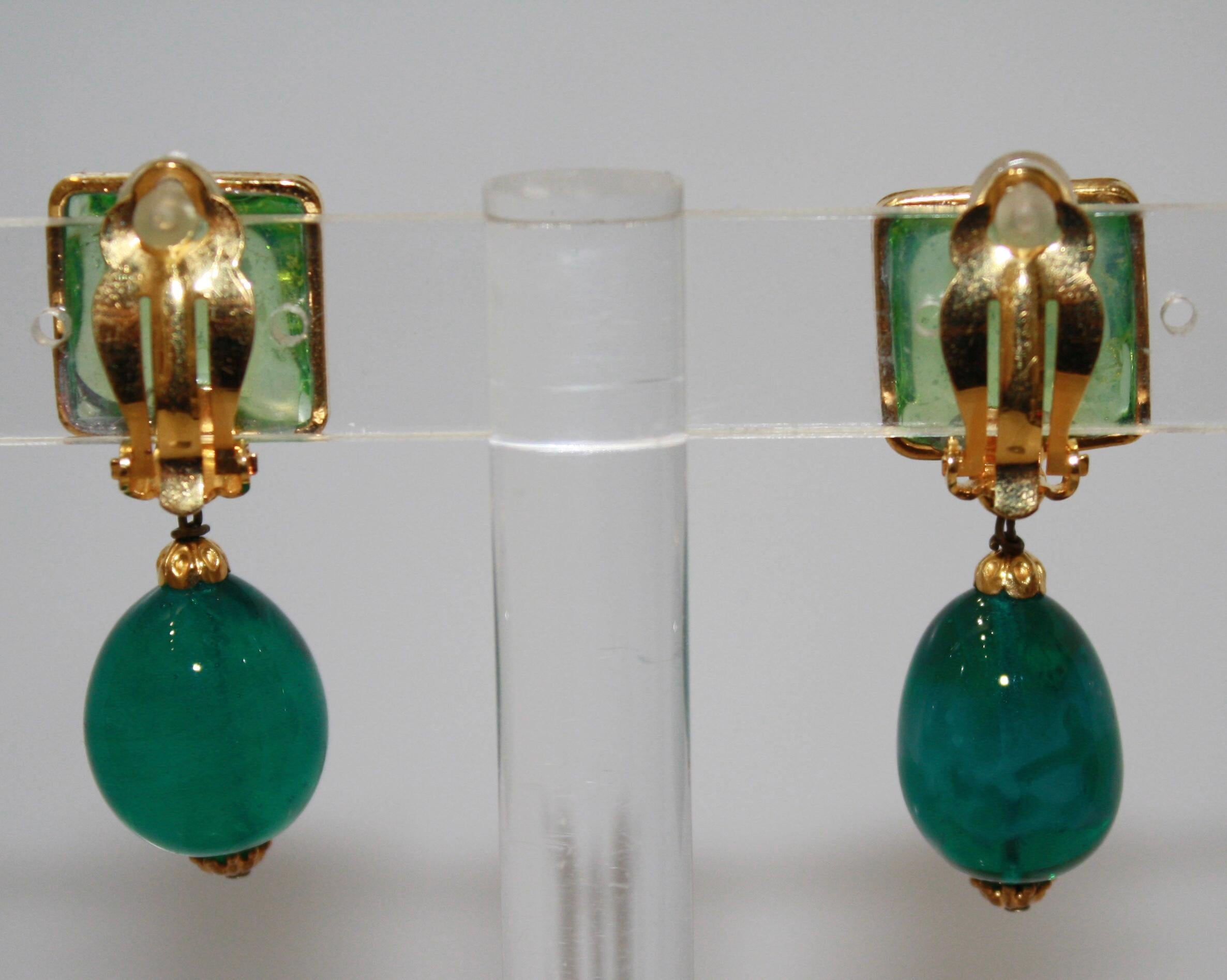 Gripoix work by the former artisans of the atelier, masters of poured glass designs.
Clip earrings. Top part has gold leaves inlaid.
