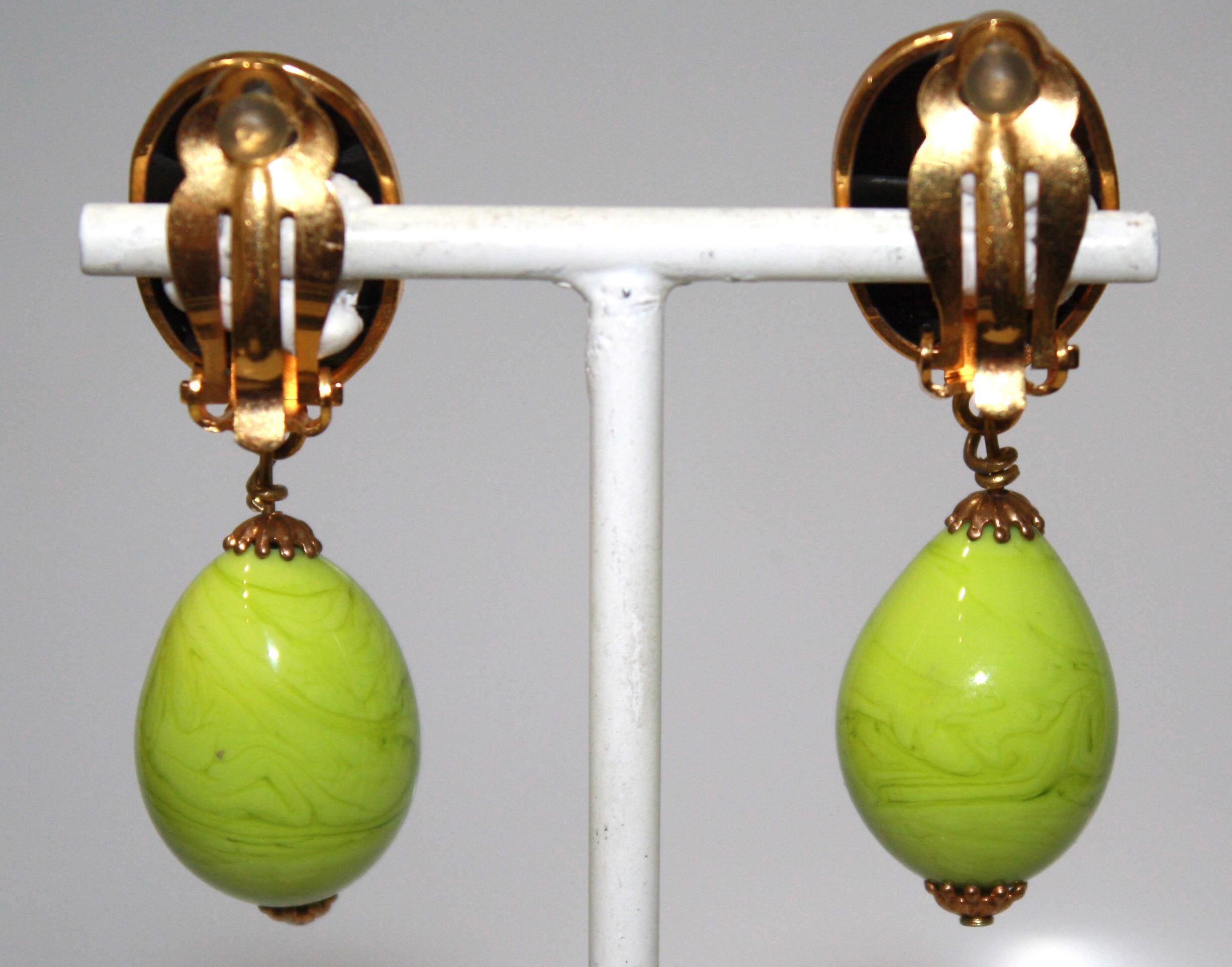 Poured glass drop earrings in green and black with gilded brass. Clips. Made by the former artisans of Gripoix in the renowned technique 