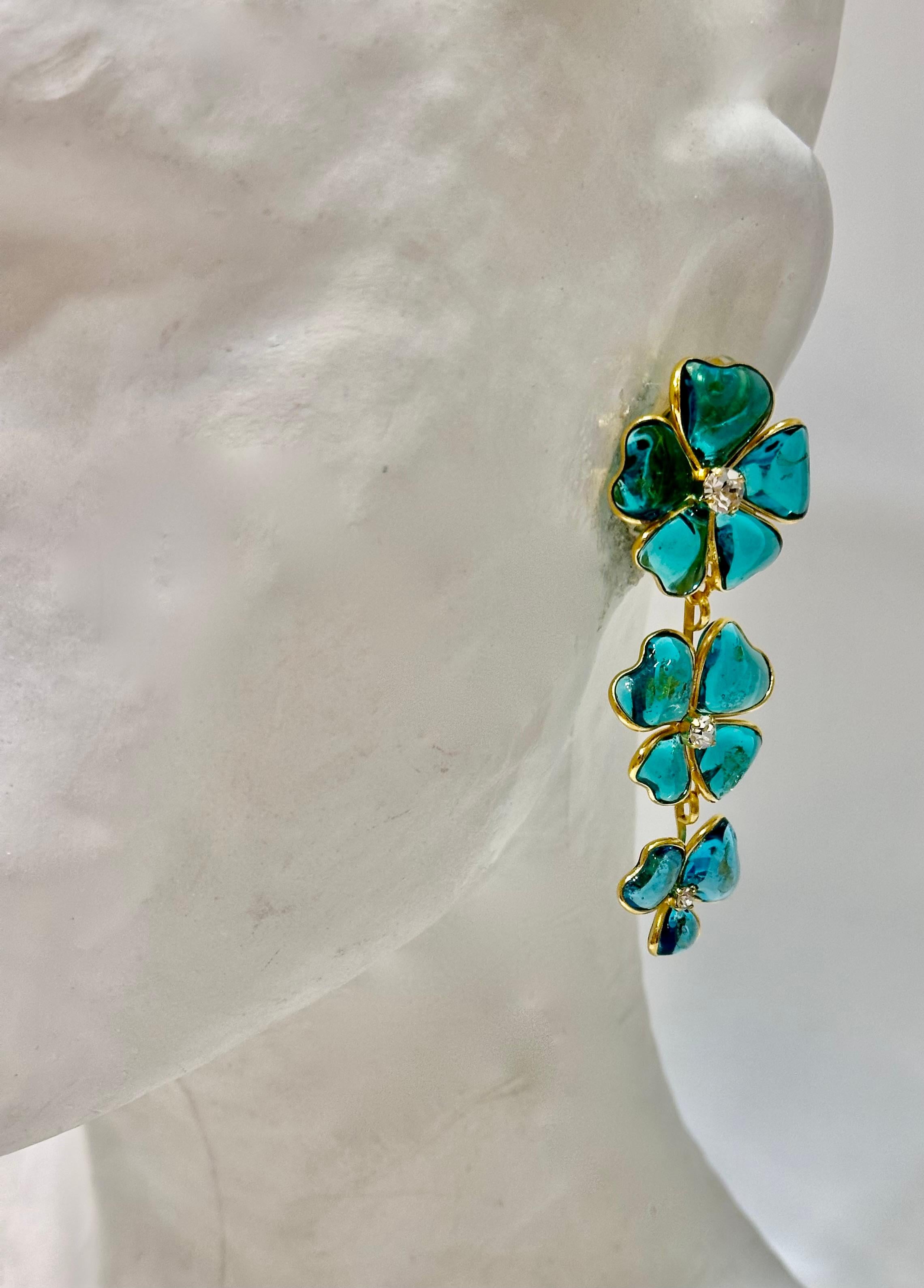 Masterfully crafted poured glass in dreamy hues of aqua green from Pate de Verre Collection.  Swarovski crystals.
Designed by a former artisan of the Atelier de GRIPOIX in the savoir faire used for all the Chanel pieces they executed.
This is a very