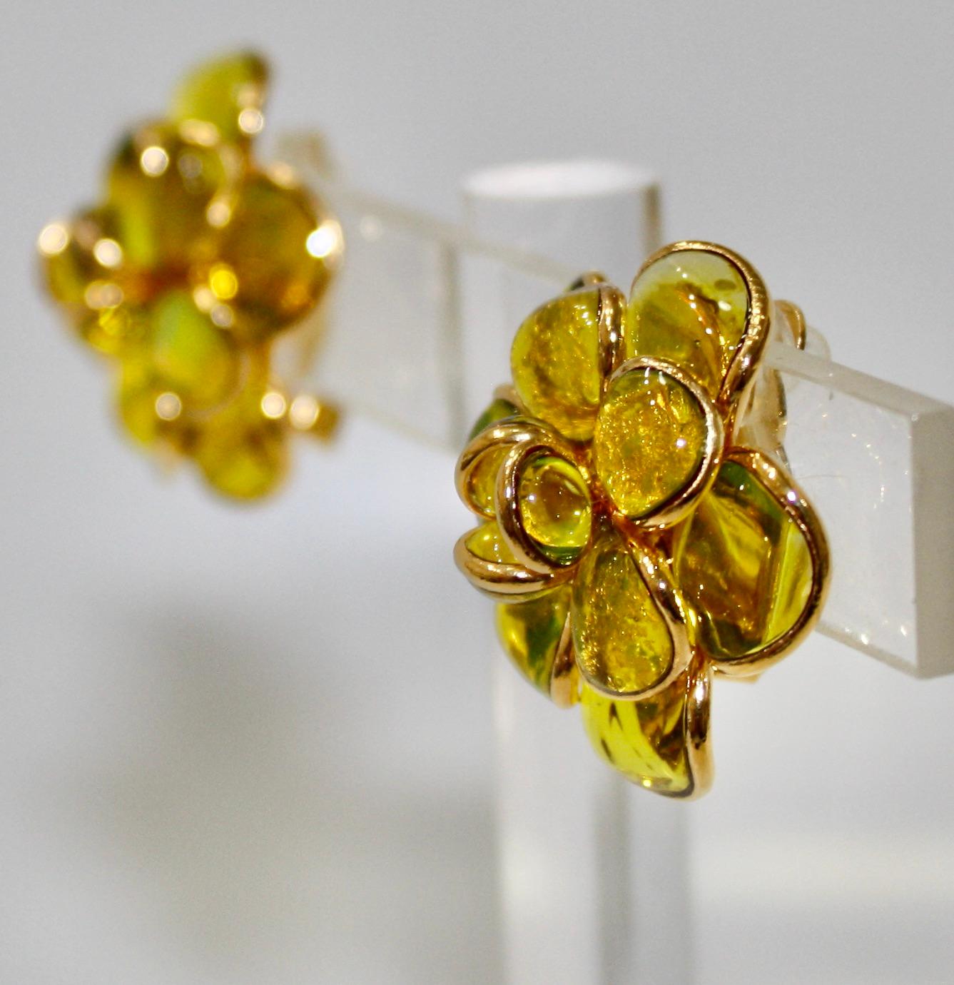 designed by the former artisans of the atelier of Gripoix, made in the special process of pate de verre or poured glass. Gold leaves are inserted in the glass. 18-carat gilded brass. Clip earrings
