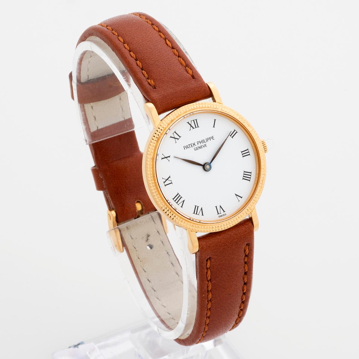 Our rare and neo vintage ladies Patek Philippe Calatrava reference 4819 features a desirable and distinctive 18k yellow gold Clous De Paris Case (25mm). The dial is roman numeral white porcelain and a new quality leather strap is fitted to the