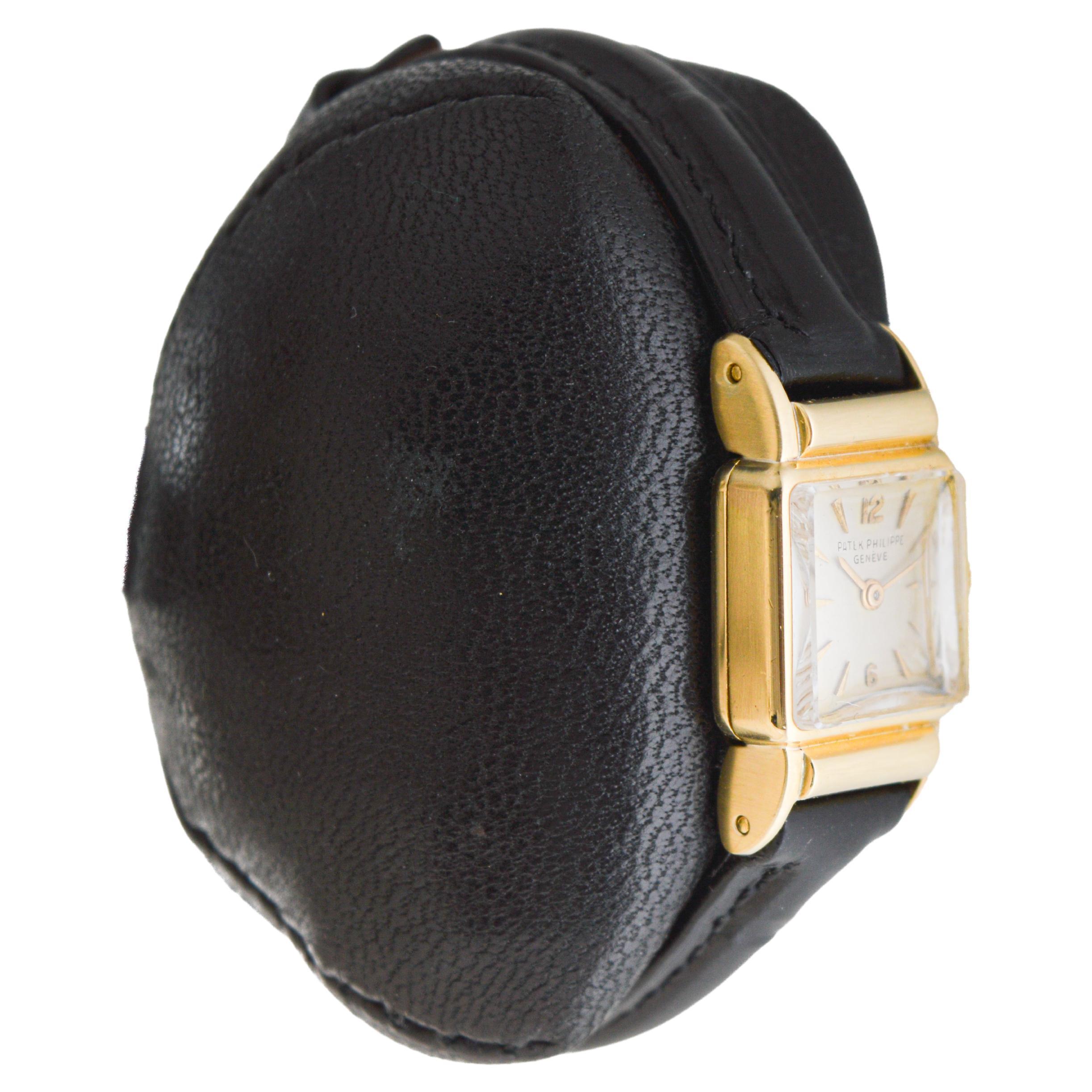 FACTORY / HOUSE: Patek Philippe 
STYLE / REFERENCE: Art Deco
METAL / MATERIAL: 18Kt Solid Gold
CIRCA / YEAR: 1953
DIMENSIONS / SIZE: Length 27mm X Width 15mm
MOVEMENT / CALIBER: Manual Winding / 19 Jewels / Caliber 3155
DIAL / HANDS: Original