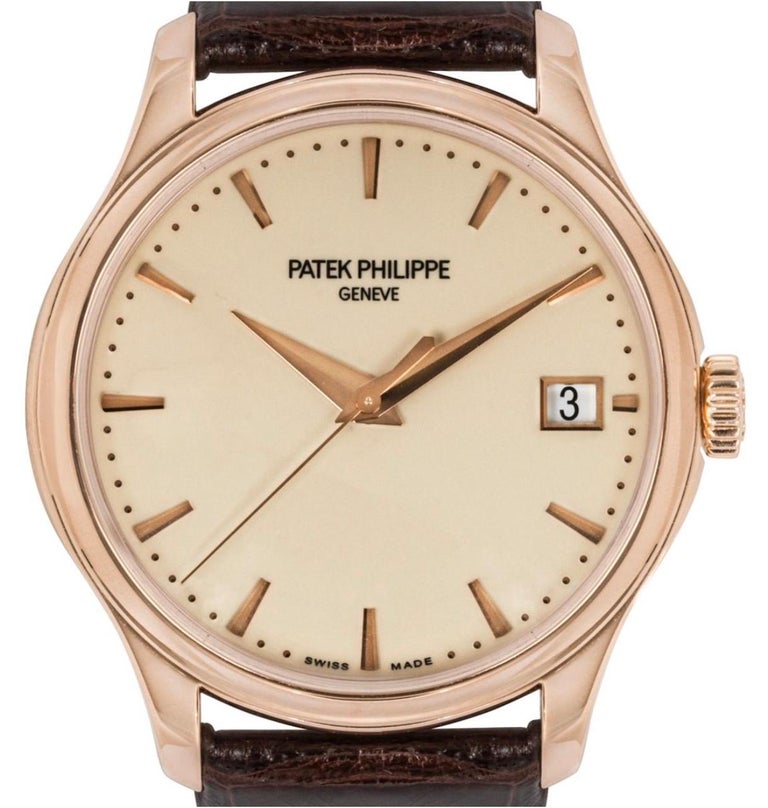 A rose gold 39mm Calatrava by Patek Philippe. Featuring an Ivory lacquered dial with applied hour markers and a rose gold bezel.

This timepiece is presented on a generic brown leather strap and a Patek Philippe rose gold pin buckle. Further fitted