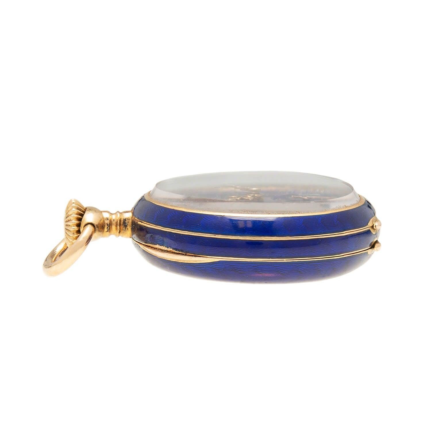 A gorgeous pocket watch by Patek & Co. from the Late Victorian (ca1890s) era! Crafted in 18k yellow gold, this stunning piece has a striking blue swriling guilloche enamel pattern. This well-made timepiece features an applied 18k gold fleur-de-lis