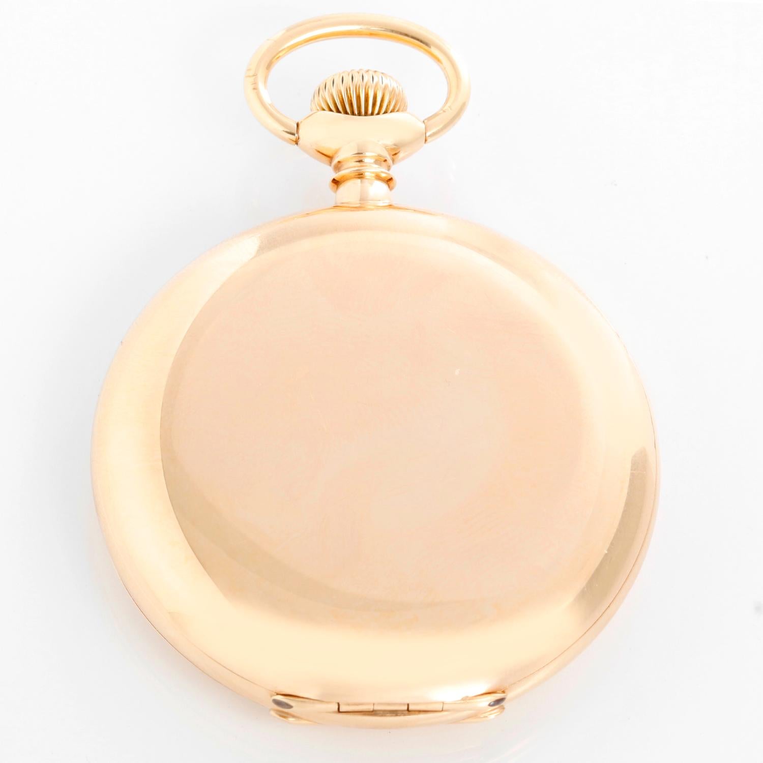 Patek Philippe 14K Yellow Gold Pocket Watch - Manual winding. 14K Yellow gold hunter case (50 mm ). White enamel dial with Roman numerals; subdial at 6 o'clock. Pre-owned with custom box.  Marked for retailer Mermod & Jaccard of St. Louis.