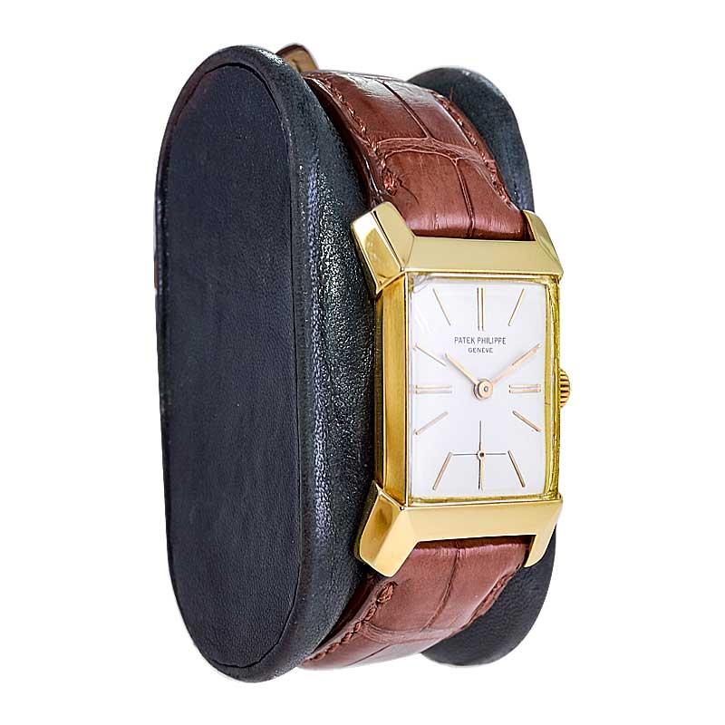 FACTORY / HOUSE: Patek Philippe & Co. 
STYLE / REFERENCE: Rectangle / Art Deco Style / 2553
METAL / MATERIAL: 18Kt Yellow Gold
CIRCA / YEAR: 1955
DIMENSIONS / SIZE: Length 38mm X Width 24mm 
MOVEMENT / CALIBER: Manual Winding / 18 Jewels / 9-90
DIAL