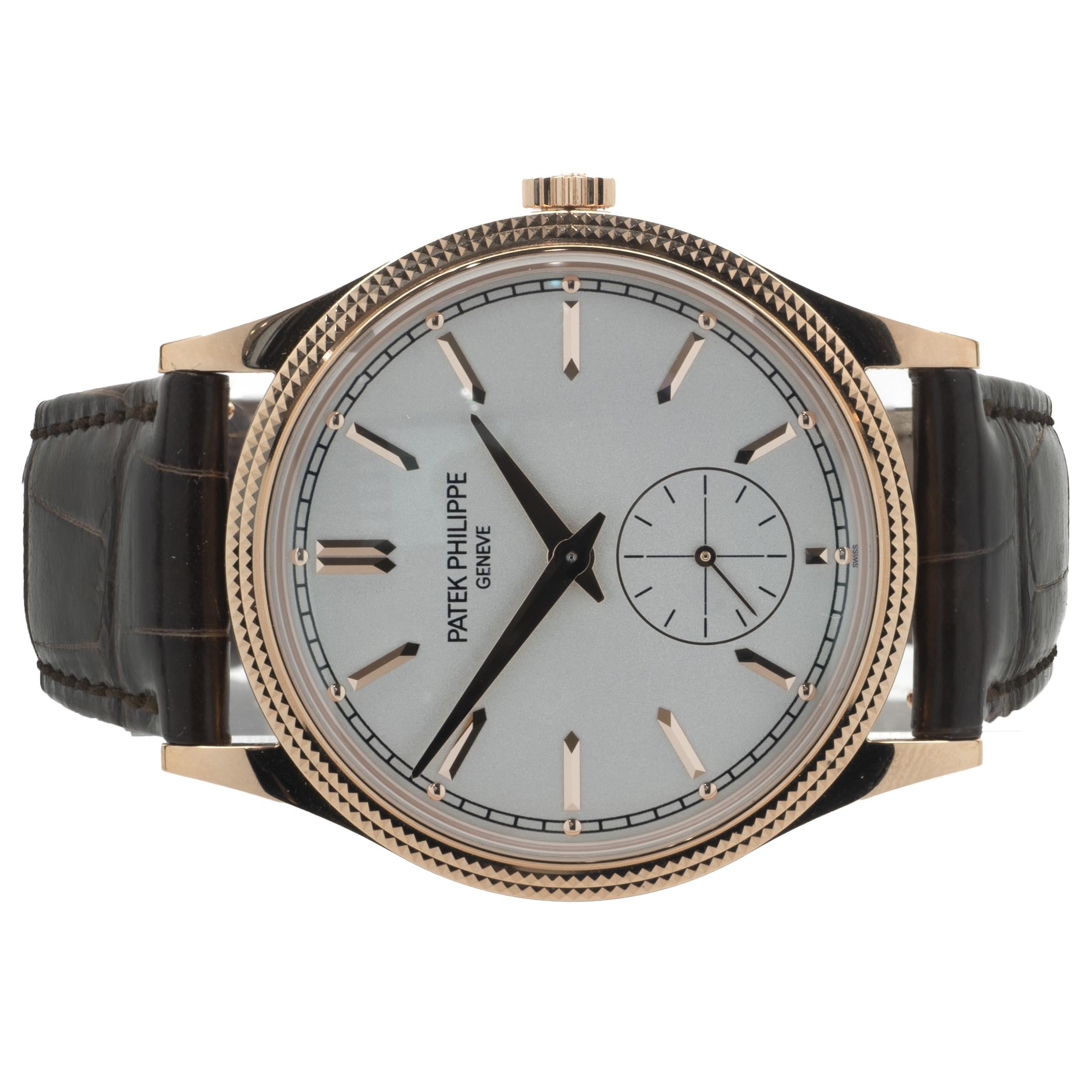 Movement: automatic
Function: hours, minutes
Case: 39mm 18K rose gold round case, sapphire crystal, hobnail pattern bezel
Dial: silver and rose stick dial
Band: brown Patek Philippe leather strap, 18K rose gold buckle
Reference #: 6119R
Serial #: