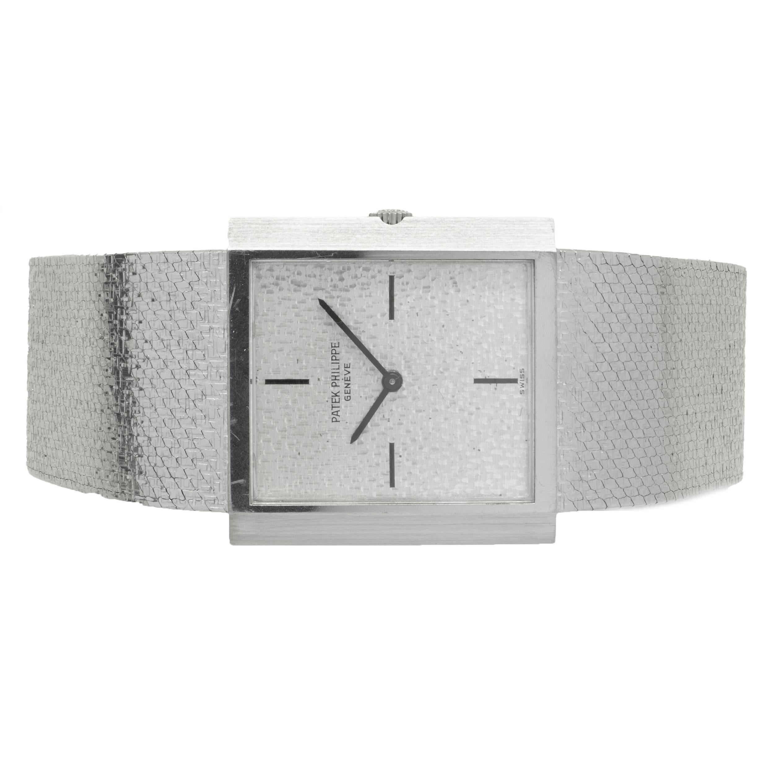 Movement: automatic
Function: hours, minutes
Case: 26 X 26mm 18K white gold square case, sapphire crystal
Dial: silver etched stick dial
Band: Patek Philippe 18K white gold custom mesh style bracelet
Reference #: 3491 / 3
Serial #:
